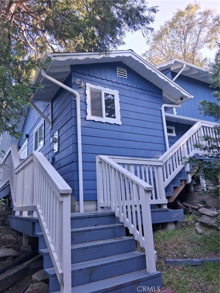 This 4 bedroom home sits back from the street which allows for privacy and plenty of parking. The laundry/mud room is off the kitchen. U-shaped kitchen opens up to living room where there is a dining table. In the living room is a wood burning fireplace for those cold winter days. For summer entertaining a large deck is off the living room. Main level has two bedrooms and full bathroom. Upper level has two bedrooms and a 3/4 bath, no bath tub. There is a split system in each bedroom upstairs. Furnishings are negotiable.