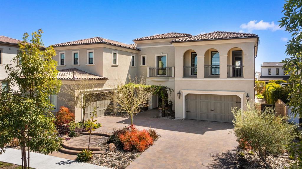 Stunning Toll Brothers estate in the exclusive gated community of Palomar at Pacific Highlands Ranch. Built in 2020, this 5-bedroom, 5.5-bathroom home offers 6,042 sqft of elegant living space on an expansive 11,308 sqft lot. The grand entry welcomes you with a soaring double-height foyer and a dramatic 7-ft wide staircase. The open-concept layout centers around a chef’s kitchen featuring a quartz waterfall island, Sub-Zero refrigerator, Wolf double ovens, Asko dishwasher, custom cabinetry, and an oversized walk-in pantry. Two large sliding glass doors connect the main living areas seamlessly to the beautifully designed backyard—complete with professional landscaping, mature trees, water feature, built-in BBQ, outdoor kitchen, covered patio, and 6-person spa. The main floor includes a private office, formal dining room, and a guest suite with ensuite bath. Upstairs, the expansive primary retreat offers a private lounge area, spa-inspired bathroom, and dual walk-in closets. All secondary bedrooms feature ensuite baths and custom closets. A converted sunroom provides additional flexible space for a second family area, music room, or casual dining. Zoned to top-tier schools: Solana Santa Fe Elementary, Pacific Trails Middle, and Canyon Crest Academy (CCA). Community amenities include pool, spa, gym, parks, and scenic trails.