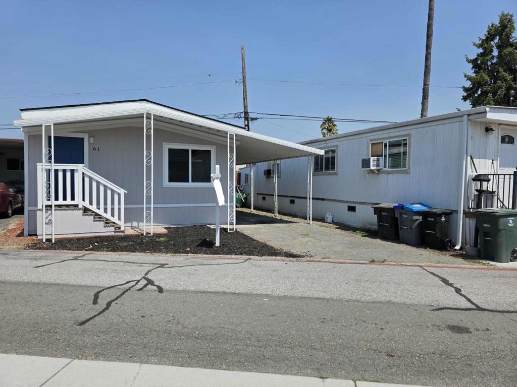 Welcome to this charming 2-bedroom, 2-bathroom home in the vibrant city of Mountain View. Live minutes away from downtown Mountain View and five minutes away from Google Headquarters. Spanning 800 square feet, this cozy residence offers a well-designed layout perfect for modern living. The kitchen is equipped with a gas oven, dishwasher, refrigerator, and an island, making meal preparation a breeze. The countertops are both stylish and functional, providing ample space for culinary adventures. Low space rent at $940 makes daily living much more enjoyable. The open dining area seamlessly connects to the living room, creating a welcoming space for entertaining. Enjoy warmth and ambiance from the fireplace, a delightful feature for cooler evenings. The home features a combination of hardwood and laminate flooring, adding elegance and comfort throughout. Practical amenities include laundry hookups, ensuring convenience for everyday chores. Located within the Whisman Elementary School District, this home offers a desirable neighborhood setting. With its thoughtful design and prime location, this Mountain View gem is a must-see for those seeking comfort and convenience.