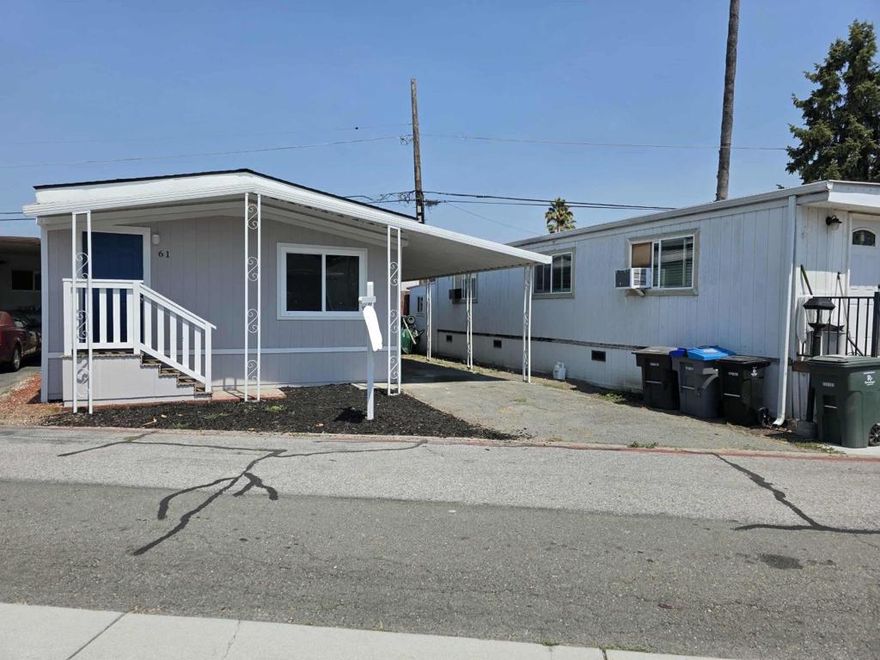 Welcome to this charming 2-bedroom, 2-bathroom home in the vibrant city of Mountain View. Live minutes away from downtown Mountain View and five minutes away from Google Headquarters. Spanning 800 square feet, this cozy residence offers a well-designed layout perfect for modern living. The kitchen is equipped with a gas oven, dishwasher, refrigerator, and an island, making meal preparation a breeze. The countertops are both stylish and functional, providing ample space for culinary adventures. Low space rent at $940 makes daily living much more enjoyable.   The open dining area seamlessly connects to the living room, creating a welcoming space for entertaining. Enjoy warmth and ambiance from the fireplace, a delightful feature for cooler evenings. The home features a combination of hardwood and laminate flooring, adding elegance and comfort throughout.  Practical amenities include laundry hookups, ensuring convenience for everyday chores. Located within the Whisman Elementary School District, this home offers a desirable neighborhood setting. With its thoughtful design and prime location, this Mountain View gem is a must-see for those seeking comfort and convenience.