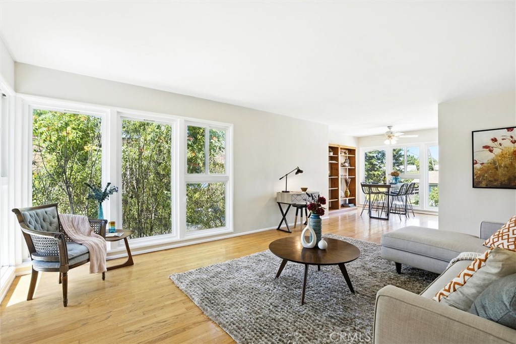 Wonderful, light and spacious 2 bed 2 bath condo w/parking and AC and low HOA fees in excellent Carroll Park location, one block to Retro Row, less than a mile to the water. Dual pane vinyl windows, hardwood floors, zoned cooling (mini-splits), huge primary bedroom with en suite bathroom and walk-in closet. Kitchen and en suite bathroom have been updated, and the other bathroom is still bringing vintage vibes with pink porcelain sink and tun and built-in vanity. One deeded off-street parking spot, 2 community laundry rooms for convenience in low maintenance complex. Short easy distance to all the fun shops and restaurants that this area has to offer. This is the one you've been waiting for!
