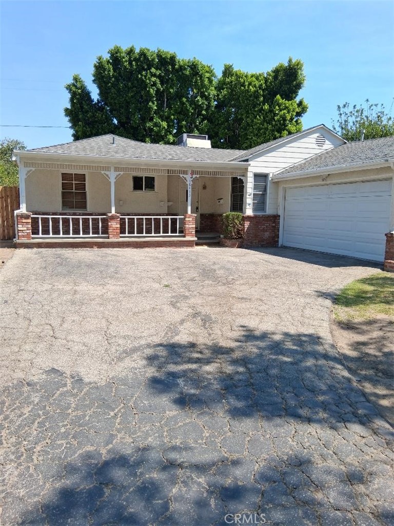 LOVELY HOME LOCATED ON A QUIET AND SERENE STREET IN TARZANA. 4TH BEDROOM HAS BEEN CONVERTED INTO A FAMILY ROOM WITH FIREPLACE. HARDWOOD AND LAMINATED FLOORING THROUGHOUT. NEWER TILES IN THE KITCHEN AND BATHROOM. CENTRAL AIR AND HEAT. COVERED PATIO. TWO CAR GARAGE. GREAT CURB APPEAL. CLOSE TO EVERYTHING.