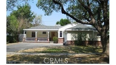 LOVELY HOME LOCATED ON A QUIET AND SERENE STREET IN TARZANA. 4TH BEDROOM HAS BEEN CONVERTED INTO A FAMILY ROOM WITH FIREPLACE. HARDWOOD AND LAMINATED FLOORING THROUGHOUT. NEWER TILES IN THE KITCHEN AND BATHROOM. CENTRAL AIR AND HEAT. COVERED PATIO. TWO CAR GARAGE. GREAT CURB APPEAL. CLOSE TO EVERYTHING.