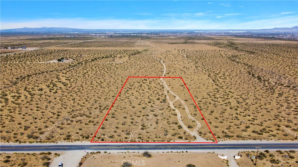 EXTREMELY MOTIVATED SELLER!! PRICE IMPROVEMENT!!! 5 acre flat lot. The owner has survey done to build. Possible to rezone to add 10 units for an investor? Located within the Snowline school district. Build a custom home, on pavement and enjoy the view of the mountains.