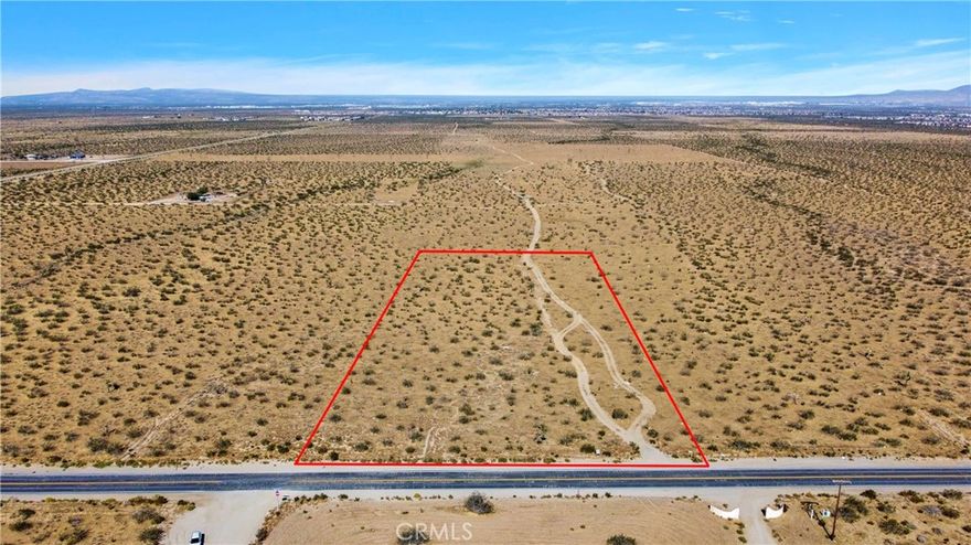 EXTREMELY MOTIVATED SELLER!! PRICE IMPROVEMENT!!!  5 acre flat lot. The owner has survey done to build. Located within the Snowline school district. Build a custom home on pavement and enjoy the view of the mountains.
