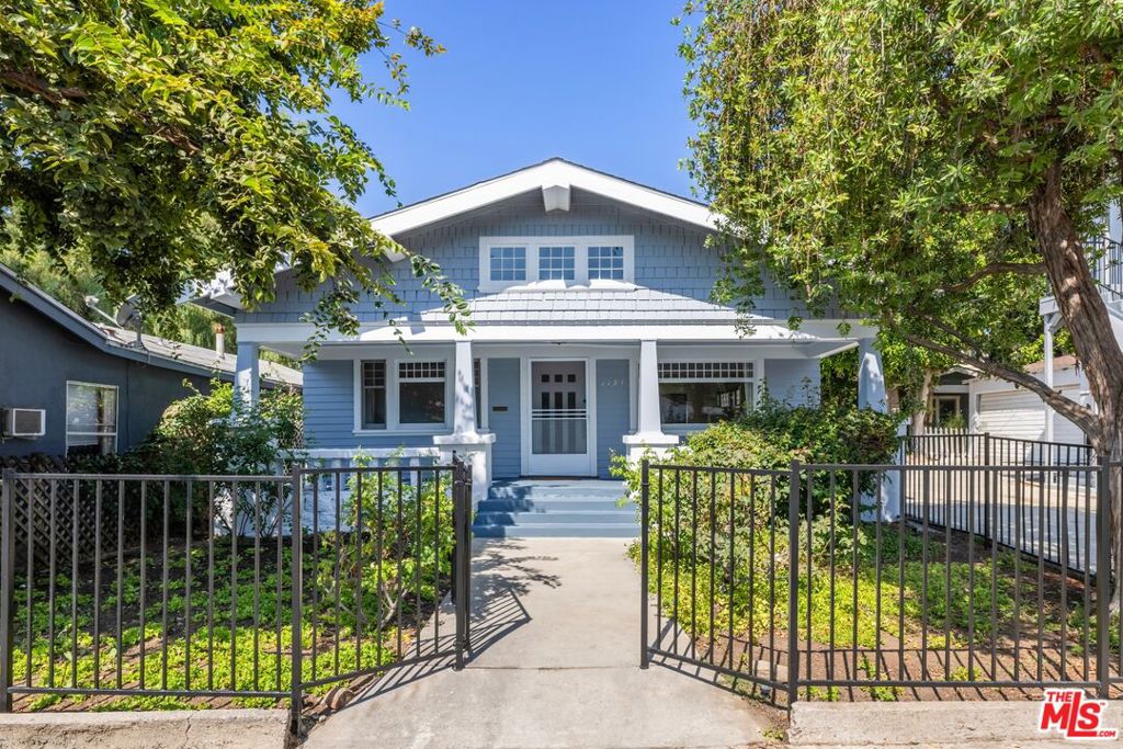 Charming Bungalow in desirable Weho Location. Through your own gates, enter via your private front yard and porch into a light filled inviting open space that offers a great flow from the double living room to dining (with fireplace) and kitchen and a private backyard. Period details like built ins and fireplace, hardwood floor enhance the just updated home. Two generously sized bedrooms, each with their own bath complete the single level space. Located within minutes from Sunset and Santa Monica Blvd with restaurants, shopping and conveniences, yet private and secluded providing a safe haven from it all.