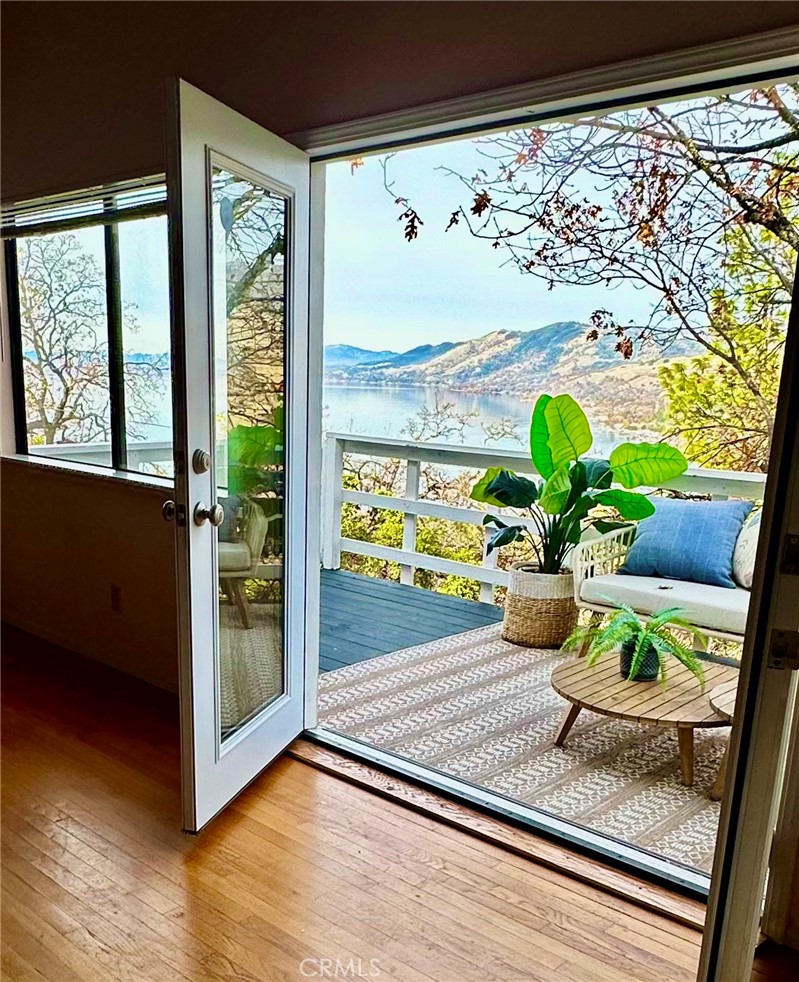 Calling all investors and relaxation seekers: Motivated seller for this prestigious mountain RETREAT set privately behind a gated setting & high above the surrounding hills and lake for ultimate privacy and spectacular views.  Perfect vacation home or Airbnb, this home is close to shopping, the lake, Highway 20 for easy commuting to Ukiah.  This property is set on nearly 1/2 acre which allows plenty of parking for cars, boats, toys.  Featuring 3 bedroom, 3 bath for this tri-level home with open floor plan, updated kitchen open to living room area, vaulted ceilings and providing a spacious 2,184 square feet of living space. Entry on ground level or up stairs to main living area.  One main level bedroom and 2 upstairs bedrooms PLUS ground level BONUS ROOM, entertainment room or additional bedroom with its own gated yard.  New kitchen countertops, new cabinets, new flooring and new appliances (dishwasher, stove, refrigerator).  New French doors on main level.  Attached garage with new garage door, new water heater, new paint in bedrooms, new vanity top and mirrors in upstairs bath, new window blinds, roof less than 10 years old.   Fully fenced with plenty of usable outdoor space and covered patio, mature trees and grass area.  Clear Lake is part of California's Wine Country which includes Napa, Sonoma and Mendocino Counties with Lake still boasting an affordable Real Estate Market.  It includes nine American Viticultural Areas and around 20 bonded wineries.  Lake County regularly ranks on the list for best air quality.  One of California's hottest new wine destinations, Lake County is home to Clear Lake, the largest natural freshwater lake in CA and Mount Konocti, an ancient volcano for excellent hiking, biking and fishing opportunities.  Clean air, scenic beauty, fine wines and unsurpassed recreation await!  Head to the Lake!  (visitcalifornia.com & lakecountyca.gov).