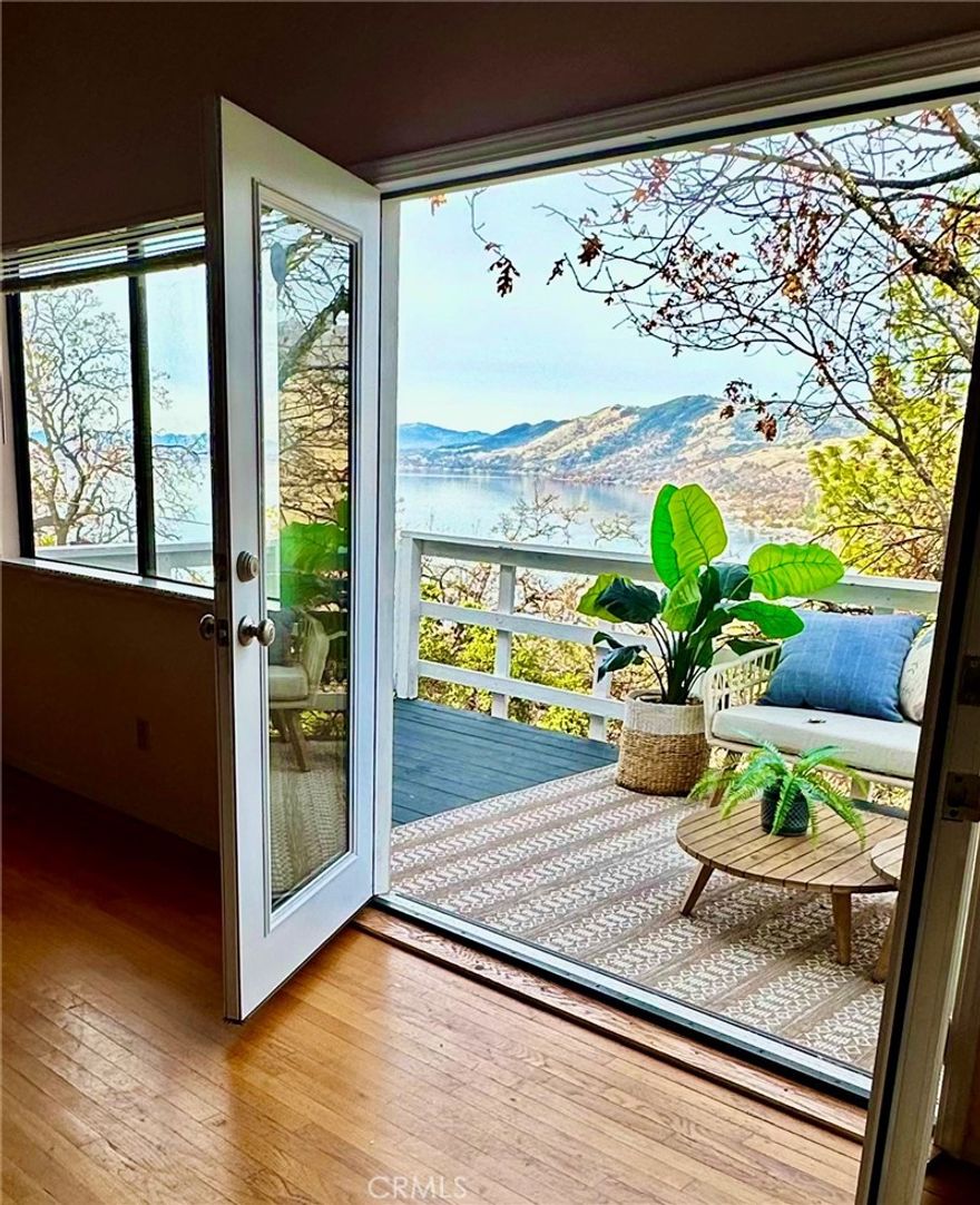 Calling all investors and relaxation seekers: Motivated seller for this prestigious mountain RETREAT set privately behind a gated setting & high above the surrounding hills and lake for ultimate privacy and spectacular views.  Perfect vacation home or Airbnb, this home is close to shopping, the lake, Highway 20 for easy commuting to Ukiah.  This property is set on nearly 1/2 acre which allows plenty of parking for cars, boats, toys.  Featuring 3 bedroom, 3 bath for this tri-level home with open floor plan, updated kitchen open to living room area, vaulted ceilings and providing a spacious 2,184 square feet of living space. Entry on ground level or up stairs to main living area.  One main level bedroom and 2 upstairs bedrooms PLUS ground level BONUS ROOM, entertainment room or additional bedroom with its own gated yard.  New kitchen countertops, new cabinets, new flooring and new appliances (dishwasher, stove, refrigerator).  New French doors on main level.  Attached garage with new garage door, new water heater, new paint in bedrooms, new vanity top and mirrors in upstairs bath, new window blinds, roof less than 10 years old.   Fully fenced with plenty of usable outdoor space and covered patio, mature trees and grass area.  Clear Lake is part of California's Wine Country which includes Napa, Sonoma and Mendocino Counties with Lake still boasting an affordable Real Estate Market.  It includes nine American Viticultural Areas and around 20 bonded wineries.  Lake County regularly ranks on the list for best air quality.  One of California's hottest new wine destinations, Lake County is home to Clear Lake, the largest natural freshwater lake in CA and Mount Konocti, an ancient volcano for excellent hiking, biking and fishing opportunities.  Clean air, scenic beauty, fine wines and unsurpassed recreation await!  Head to the Lake!  (visitcalifornia.com & lakecountyca.gov).