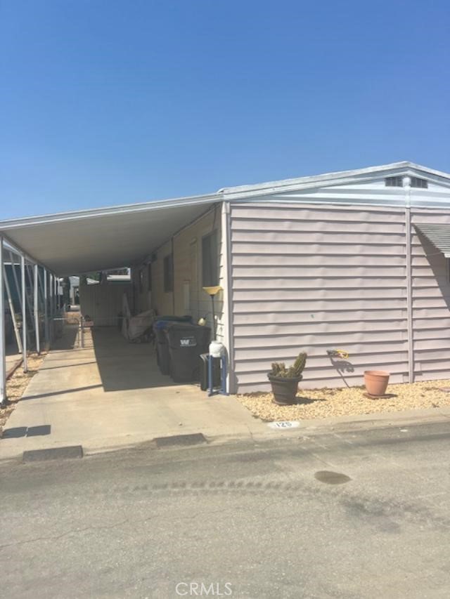 Great opportunity to own an affordable manufacture home in the 55+ senior community of Hillside Mobil Home Estates! This home is ready for your imagination to transform it into your perfect dream home! Two bedrooms, two bathrooms with a spacious living area and additional dining area, kitchen with Lots of cabinets and a Pantry. Family room. There is a extra area inside the home that is gated off for your pet if needed. The Car Port has room for 1 car, and there's a shed available for storage .There is a fenced area around side and back of home. Lets call this your home! Located in the middle of the park, with guest parking right outside your carport which makes for a convenient location as well. The Hillside Mobil Home Estates offers a clubhouse and a pool for convenience and it's a very quick drive to shopping, restaurants, and the freeway!