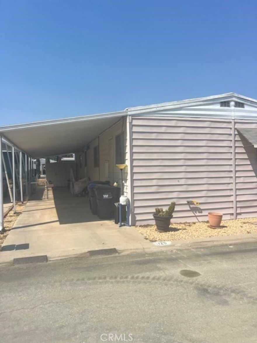 Great opportunity to own an affordable manufacture home in the 55+ senior community of Hillside Mobil Home Estates! This home is ready for your imagination to transform it into your perfect dream home! Two bedrooms, two bathrooms with a spacious living area and additional dining area, kitchen  with Lots of cabinets and a Pantry. Family room. There is a extra area inside the home that is gated off for your pet if needed. The Car Port has room for 1 car, and there's a shed available for storage .There is a fenced area around side and back of home. Lets call  this your home! Located in the middle of the park, with guest parking right outside  your carport which makes for a convenient location as well. The Hillside Mobil Home Estates offers a clubhouse and a pool for convenience and it's a very quick drive to shopping, restaurants, and the freeway!