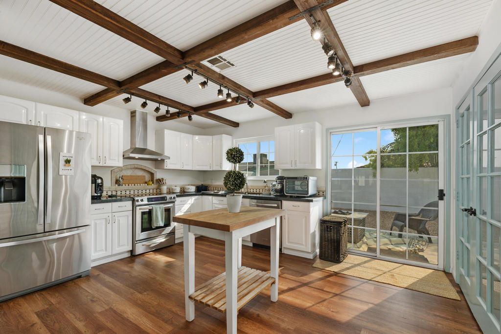GEM of the Desert in La Quinta Cove - This beautifully remodeled 3-bedroom, 2-bathroom home is nestled on an oversized lot in the highly sought-after La Quinta Cove, offering breathtaking views of the Santa Rosa Mountains. With 1,836 sq ft of thoughtfully designed living space, the home has been freshly painted and is truly move-in ready.Notable upgrades include a brand-new saltwater pool, fully owned Tesla solar panels, a tankless water heater, whole-home water softening and filtration system, upgraded flooring throughout, and a newly installed Shasta White Cool Roof for optimal energy efficiency.The open-concept layout creates an effortless flow from the stylish kitchen--featuring hardwood like floors, granite countertops, stainless steel appliances, and a walk-in pantry--to the spacious dining area and great room anchored by a cozy fireplace. Perfectly suited for both entertaining and everyday living, this home blends indoor comfort with inviting outdoor spaces.Step outside into your private desert retreat, complete with a front-facing pool and cantina, a large backyard with mountain views, a built-in BBQ, optional Z Grill smoker, and propane gas grill--ideal for enjoying the best of desert living.The primary suite serves as a tranquil escape with its own fireplace, luxurious soaking tub, and dual walk-in closets. The third bedroom features a private entrance, offering flexibility for guests, a home office, or potential rental income.Additional highlights include a circular driveway with ample parking for RVs, boats, or trailers, no HOA, and an unbeatable location just minutes from Old Town La Quinta, scenic hiking trails, championship golf, and top-tier tennis facilities.A rare opportunity to own a stylish and energy-efficient desert oasis with all the comforts of luxury living.