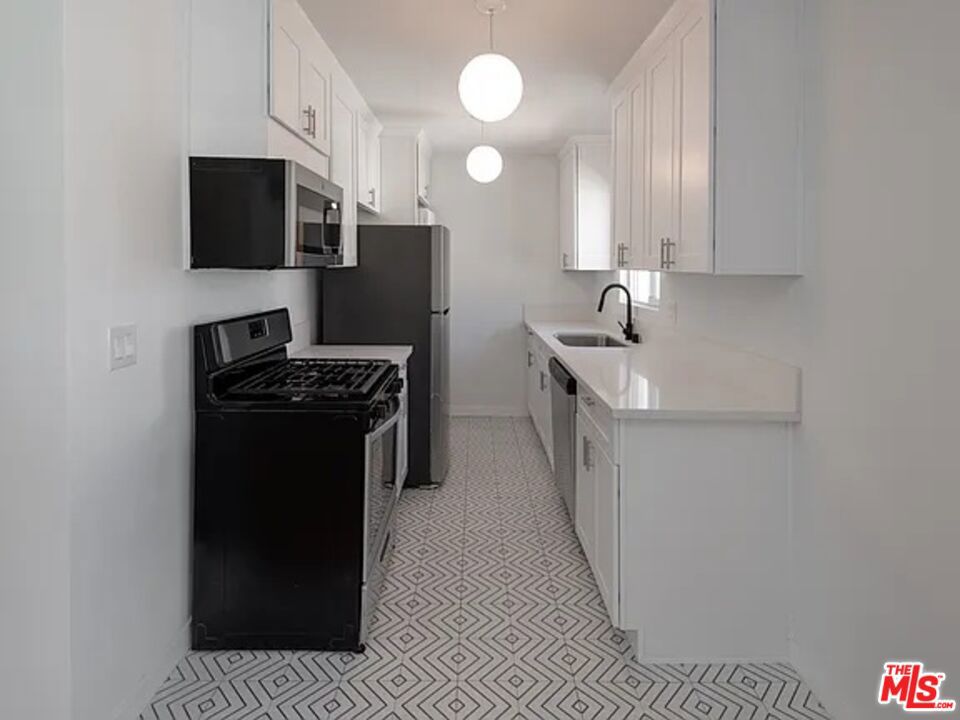 Experience the perfect blend of classic charm and modern comfort in this spacious 2-bedroom, 1-bath apartment boasting approximately 1,000 sq. ft. of thoughtfully designed living space in a beautifully maintained 1940s fourplex near the heart of vibrant West Adams. Sunlight pours through large windows, highlighting the hardwood floors and creating a warm, welcoming atmosphere. The well-appointed kitchen features ample cabinet storage and a cozy dining area ideal for both everyday meals and casual entertaining. With just four units in the building, residents enjoy a quiet, community-oriented feel along with conveniences like on-site laundry and shared outdoor space. Located just minutes from major freeways, public transit, and a lively mix of local shops and restaurants, this charming apartment offers the best of city living with a peaceful, neighborhood vibe. Don't miss your chance to call this inviting space your next home!