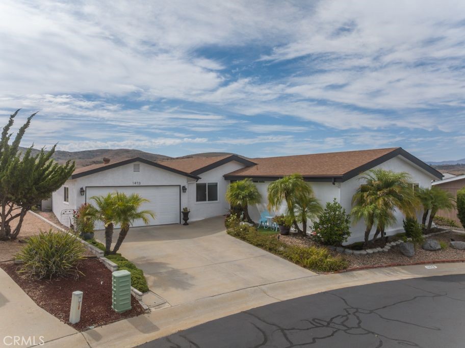 Welcome to 1473 Salem Ct, located in the desirable community of Pilgrim Creek Estates in Oceanside. This property offers 3 bedrooms & 3 full bathrooms, plus an oversized bonus room with its own private entrance, a bathroom, and a kitchenette. This space is perfect as a man cave, a crafts room, or for whatever you desire. This home also features two master bedrooms, providing exceptional versatility. Nestled on a quiet cul-de-sac, this home enjoys some of the best views in Oceanside, providing a serene backdrop for everyday living. The current owners have taken pride in maintaining and upgrading the property, giving it the feel of a detached single-family residence. Notable upgrades include newer dual-pane windows, a newer furnace and water heater, and fresh professional interior and exterior paint. Additional highlights feature ceiling fans in rooms, plantation shutters, recessed lighting, and vaulted ceilings. The kitchen is designed for both function and style, showcasing an island, white cabinetry, stainless steel appliances, and a window overlooking the beautiful backyard. The main primary suite includes a spacious walk-in closet with generous side-to-side storage. Beyond the home itself, Pilgrim Creek Estates offers outstanding community amenities, including FREE RV parking for residents, a clubhouse, pool, spa, gym, full kitchen and Billiard tables—all designed to complement an active and social lifestyle. Whether hosting family or friends, this home is an entertainer’s delight, combining comfort, functionality, and charm in one of Oceanside’s most desirable 55+ communities. LOW HOA includes water, trash, sewer and free RV Parking! Buyer to perform their own due diligence.
