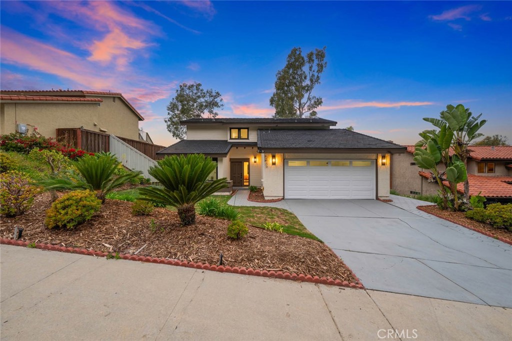 Welcome to 2959 Butler Street, an absolutely gorgeous home located in the heart of the highly desired neighborhood of Mesa Pines in Oceanside. Tastefully remodeled and sitting on a premier lot with stunning views, this home has been re-designed and re-imagined to create a true masterpiece! You are welcomed by an undeniably stunning curb appeal featuring thoughtfully designed landscaping, sleek outdoor lighting and a spacious driveway. Upon entering the front door, the magic continues. Envisioned around the art of entertaining, you will be greeted by an open floor-plan concept that flows effortlessly from one to the next, both indoor and out. From the tastefully designed living room that flows beautifully into the custom kitchen and into the backyard, to the large luxurious bedrooms and artfully crafted bathrooms, one will immediately fall in love with this home! Moving on to the backyard, your private oasis awaits! Featuring an enormous grass lawn, a huge covered patio area, and amazing views. All this surrounded by lush California landscape offering plenty of privacy. This backyard is absolutely perfect for entertaining! Located next to schools, parks, shopping centers, hiking trails and golf courses yet tucked away in a quaint and quiet street. This is one you don't want to miss!