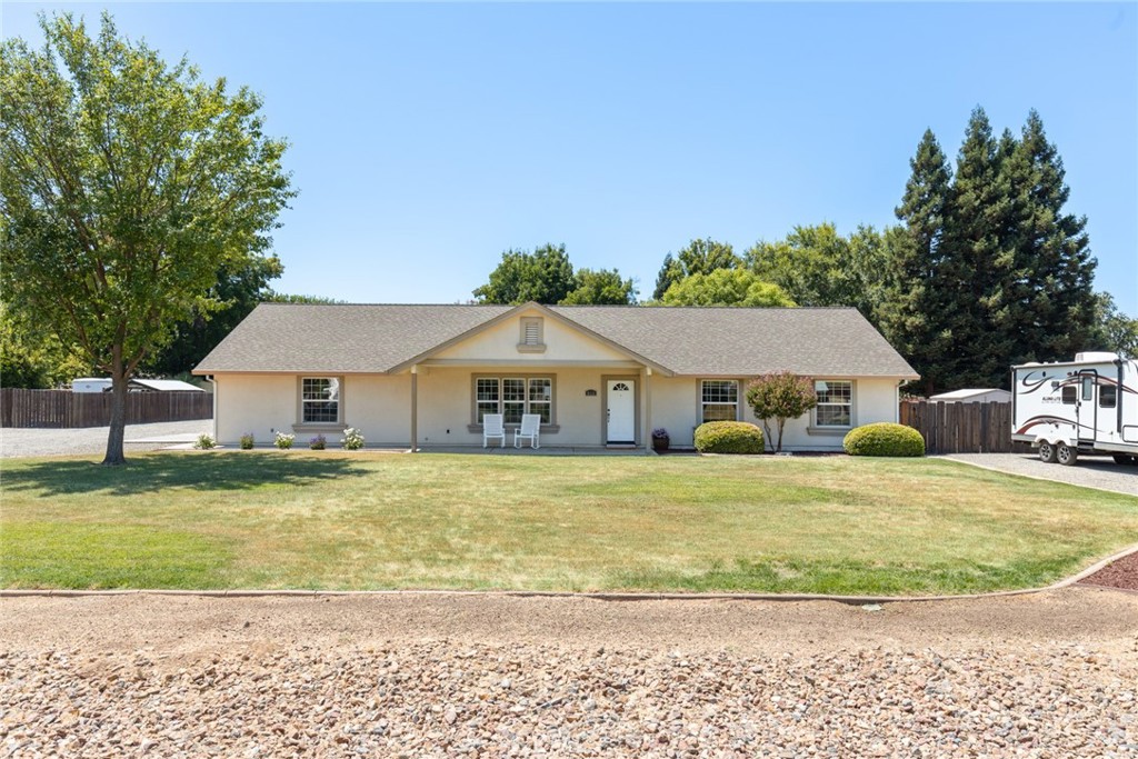 Experience the charm and serenity of country living in this beautiful 3-bedroom, 2-bath home offering 1,700 sq ft of comfortable living space on a spacious 0.62-acre cul-de-sac lot. Inside, you'll find vaulted ceilings, a bright open floor plan, fresh interior paint, and a functional kitchen with solid-surface countertops, ample cabinet space, and large breakfast bar. The primary suite and guest rooms offer generous space and natural light, while central heating and air ensure year-round comfort. Outside, enjoy a landscaped yard with a covered patio—perfect for outdoor entertaining. There’s plenty of room to add a swimming pool, shop, garden, or 4H/FFA projects, plus RV parking and additional side parking for all your toys. Enjoy peaceful country living with easy access to nearby amenities and just a short drive to Chico. Don’t miss this move-in ready home with space to grow in a quiet, rural setting.
