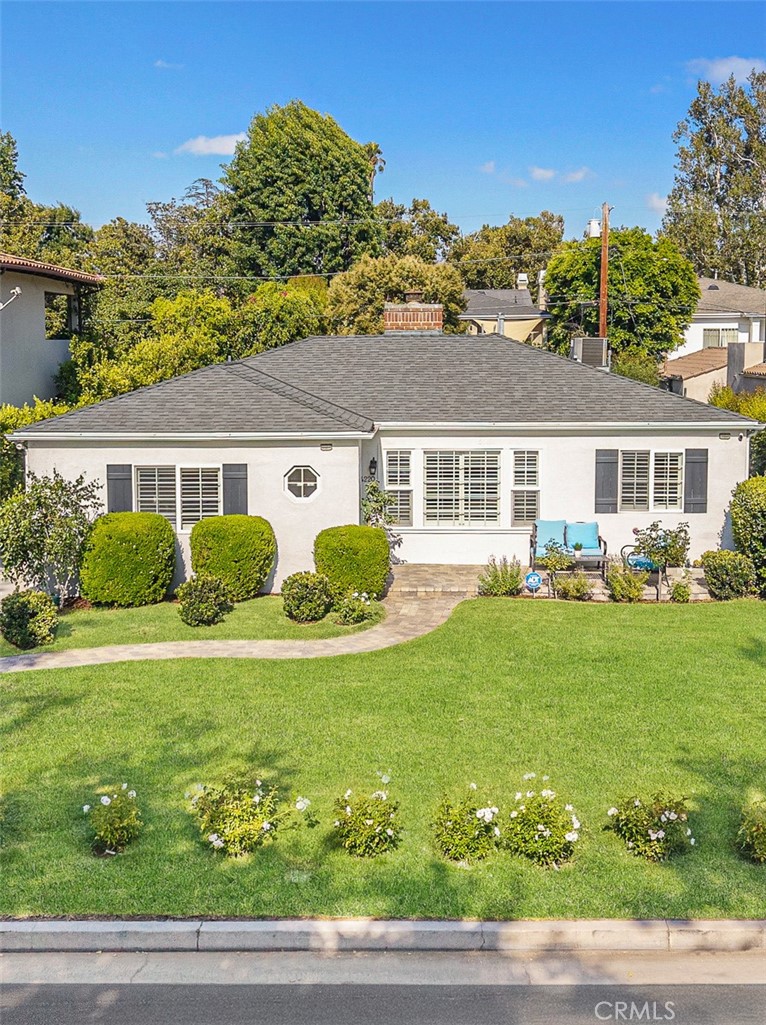 Welcome to this elegant residence nestled in one of the most desirable neighborhoods of Studio City. This beautifully designed home offers a spacious and thoughtfully laid-out floor plan featuring a bright and airy living room, formal dining area, a large family den, and three generously sized bedrooms with two full bathrooms. The living room is filled with natural light and showcases rich hardwood flooring, vaulted ceilings, a cozy fireplace, and a large picture window overlooking the manicured front garden which creates a warm and inviting ambiance. Adjacent to the kitchen, the oversized formal dining room provides the perfect setting for dinner parties and family gatherings. The expansive chef’s kitchen boasts abundant cabinetry and countertop space, along with a charming breakfast nook ideal for casual meals. The spacious family den is complete with French doors opening to the backyard, and offers incredible versatility and can be used as a home office, gym, game room, or additional entertaining space. The private primary suite includes a relaxing sitting area, a walk-in closet, and an en-suite bathroom featuring dual vanities, a spa tub, and a separate stall shower. Two additional bedrooms share a well-appointed full bath. A convenient laundry closet is located just off the kitchen for added ease. Step outside to the beautifully maintained backyard, you will fall in love with it and it is perfect for outdoor entertaining, relaxing afternoons, or peaceful tea time. The outdoor space offers privacy and potential for your dream garden or expansion. A long driveway and detached 2-car garage complete this exceptional property. Located within the highly regarded Ulysses S. Grant Senior High School and Dixie Canyon Community School District, and just minutes from newly developed shops, trendy restaurants, golf courses, the Sportsmen’s Lodge, and vibrant Studio City entertainment. Don’t miss the opportunity to own this move-in-ready gem in the heart of Studio City!