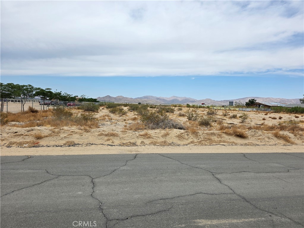 Nestled in a peaceful rural setting, this 1.66 acres stunning vacant land parcel with POWER ADJACENT offers breathtaking panoramic views of surrounding mountains in every direction. Located on a well-maintained paved road, the property combines natural beauty with convenience—just minutes from the center of town for easy access to the market, schools, and center of town. Whether you're looking to build now or invest for the future, this parcel provides the perfect balance of tranquility, access, and potential. Rural charm meets modern convenience in this rare opportunity to own land with unmatched mountain views.
(The address on this listing is not a county assigned address and is being used solely for the purpose of identification of this listing on the MLS and media.)
Latitude 34.461478 Longitude -116.910951