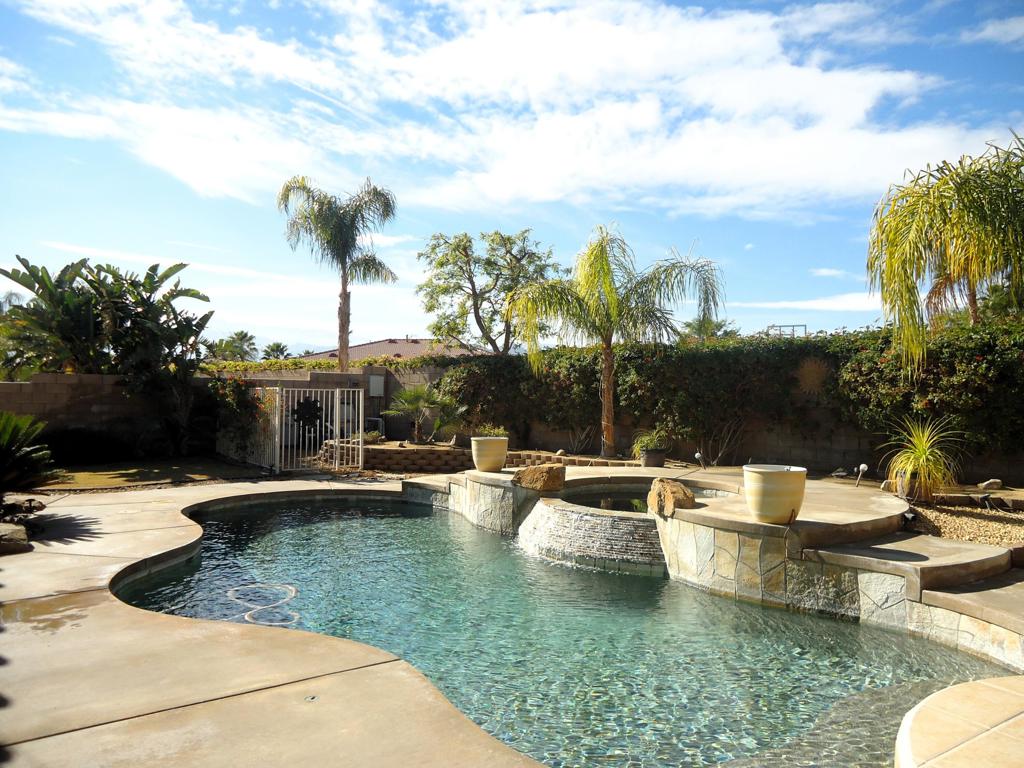 🎉 Step into your seasonal paradise at the fabulous Esplanade, where everyone's dream home becomes your reality! This beauty features 4 bedrooms, an office with built-ins for your work-from-home days, and 3 baths, all nestled in around 2,540 sq. ft. of luxurious comfort. 🍳👨‍🍳 Whip up culinary delights in the gourmet kitchen, complete with a chic center island, gleaming granite countertops, and absolute top-tier appliances! Morning coffee is best savored in the sun-kissed breakfast nook. 🌞🎶🍽 Wow your guests in style with a formal dining area that flows into a spacious great room, adorned with a media niche, surround sound, a cozy fireplace, and sliding doors leading to an absolutely dazzling backyard. 🌳💦 Dive into the sparkling Pebble Tech pool/spa or grill to your heart's content with the entertainer's BBQ under the Aluma Wood overhang and stay cool with a misting system!The backyard is not just a backyard but a slice of paradise! Imagine grassy areas, fruit trees to cultivate your own secret orchard, and awe-inspiring panoramic mountain views. 🌄🍊 Plus, don't miss the handy side yard with extra storage.Let's talk privacy -- enjoy a secluded master suite on one side with a bath that's a spa haven in itself, featuring a separate tub and stall shower, dual sinks, and a walk-in closet dreams are made of. The remaining bedrooms? They're perfectly tucked away on the opposite wing for that extra 'you time'! 🛁Soaring ceilings, solar tubes, plantation shutters, an alarm system, and stunning floors wrap this home up into a delightful package of style and security! 🏠✨