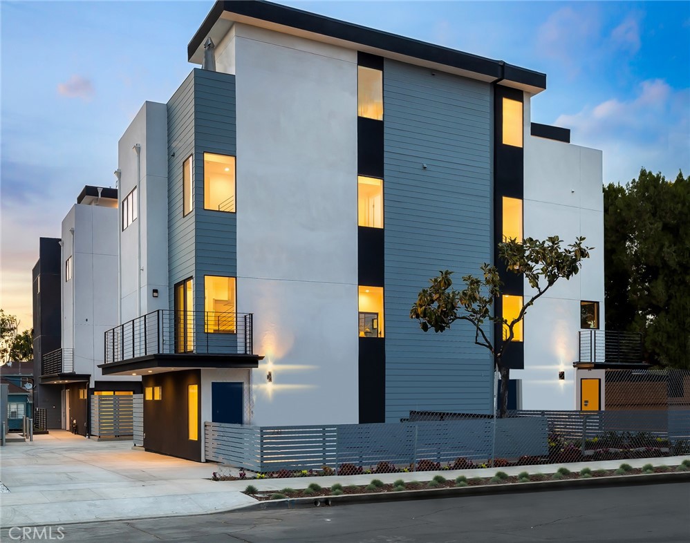Live in the heart of Echo Park in this thoughtfully designed 4-bedroom, 4.5-bathroom single-family home, part of an exclusive gated community of just six modern residences. This contemporary tri-level property offers over 2,000 square feet of living space, blending style, functionality, and smart home convenience in one of Los Angeles’ most vibrant neighborhoods. The main living level features a spacious open-concept layout ideal for entertaining, showcasing wide-plank hardwood flooring, custom cabinetry with Blum hardware, quartz countertops, and premium finishes throughout. The fourth bedroom is located on the entry level and can easily function as a flex space—perfect for a home office, fitness studio, guest suite, or creative workspace. Each of the four bedrooms is generously sized and includes its own bathroom for maximum privacy and comfort. Smart and energy-efficient features include Cat-6 cabling for seamless connectivity, a Ring video doorbell, dual-zone Nest thermostats, pre-wired surround sound, and a tankless water heater. The home is also equipped with energy-efficient appliances, including a complimentary Samsung washer and dryer. The attached 2-car garage is pre-wired for EV charging and offers Wi-Fi enabled or traditional access. Cap off your day on the private rooftop deck with panoramic views of the Downtown LA skyline, Hollywood Sign, and Griffith Observatory—your own urban oasis in the sky. Ideally situated just minutes from Echo Park Lake, Sunset Blvd, DTLA, Silver Lake, and a wide range of shopping, dining, and entertainment options. Pet Policy: Pets considered on a case-by-case basis; breed restrictions may apply. Don’t miss this rare opportunity to lease a high-design residence in one of LA’s most desirable and dynamic communities.