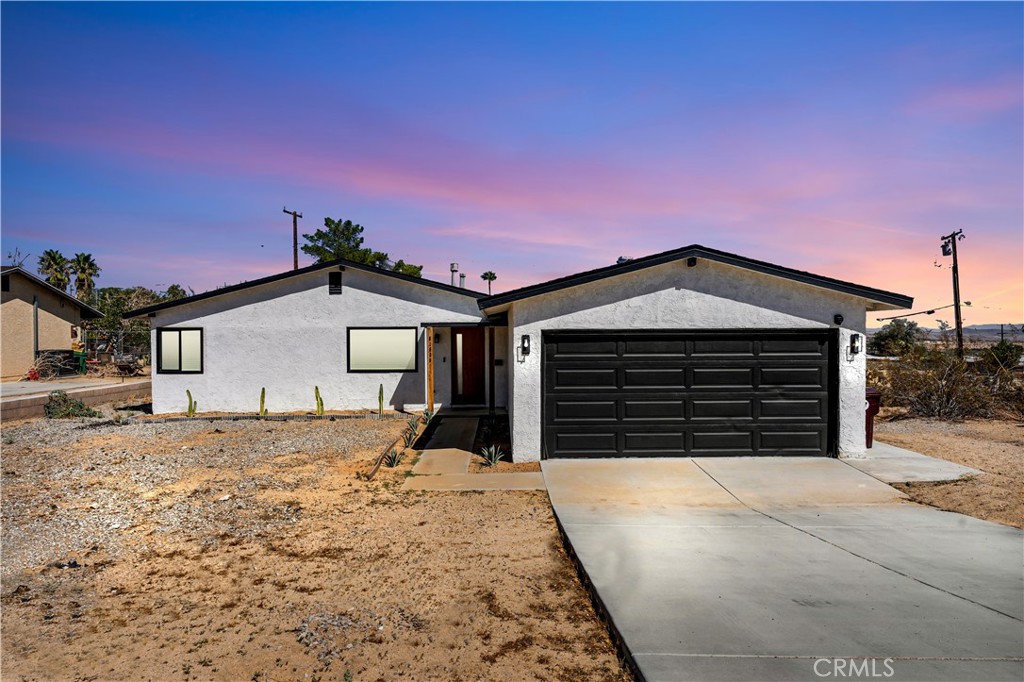 Welcome to your Stylish Desert home just 5 miles away from Joshua Tree National Park! This 2bedroom 1 bath home has been beautifully remodeled and thoughtfully designed with a BOHO-CONTEMPORARY flair! This Stunning home comes with many upgrades and highly desired features including a SPACIOUS OPEN CONCEPT layout, Custom Black Dual Pane Windows, Cement Polished Floors, Remodeled Kitchen, Newer Appliances, Newer HVAC system, 200 AMP Electrical panel, Recessed lighting, Remodeled Restroom, New Designer Light fixtures, Plumbing upgrades, Indoor laundry, Outdoor shower, Outdoor Hot tub, 2 Car attached Garage and much more! You will love the layout of this home and details throughout each room! The open concept living area is spacious with great natural lighting and perfect for indoor entertainment! This home is situated on a large 7,560 lot with large front yard and backyard. Step outside and unwind in your private desert retreat equipped with 6 person hot tub ready for stargazing under the desert skies, outdoor shower for cooling after a hot day and shaded pergola perfect for outdoor dining and relaxing. Aside of the house you will love the neighborhood and location of the home! Many restaurants, coffeeshops, Juice bars and desert hot spots in close proximity! Property can be sold Fully Furnished! Make your appointment to see this home today
