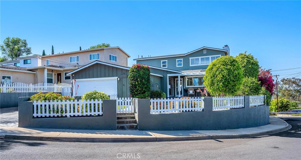Breathtaking Panoramic City views / Desirable South Torrance Hilltop home. Welcome to this stunning home located on a prime corner lot offering sweeping views from three sides of the property. Enjoy city skyline, mountains, DTLA and Harbor views. This home is truly a rare find. Boasting 4 bedrooms (potentially 5) and 2 bathrooms. This spacious residence offers an open-concept floor plan filled with natural light and unmatched vistas from most rooms and stunning refinished wood floors creating a "WOW" factor the moment you enter. Main floor highlights: Expansive living, dining, kitchen, office and bonus room- perfect for everyday living and entertaining. Updated modern Kitchen with shaker style cabinetry, a stylish oversized peninsula/bar with ample counter and cabinet space. 3 bedrooms, including one currently used as a home office. Remodeled main floor bathroom. Cleverly concealed laundry area within the kitchen. Upstairs: Versatile bonus/play/work room with fireplace. 2 additional bedrooms, ideal for creating a luxurious primary suite complete with a walk in closet and new bathroom- bring your vision and creativity! 2 Car Attached Garage with 220v power. Outdoor Living: Beautifully landscaped with easy care turf, fruit trees and manicured greenery. Spacious entertaining deck with custom BBQ area. Perfect for sunset dinners and weekend gatherings. Just minutes from award winning schools, scenic parks, shopping and world class beaches. Don't miss this chance to make this exceptional view home yours.