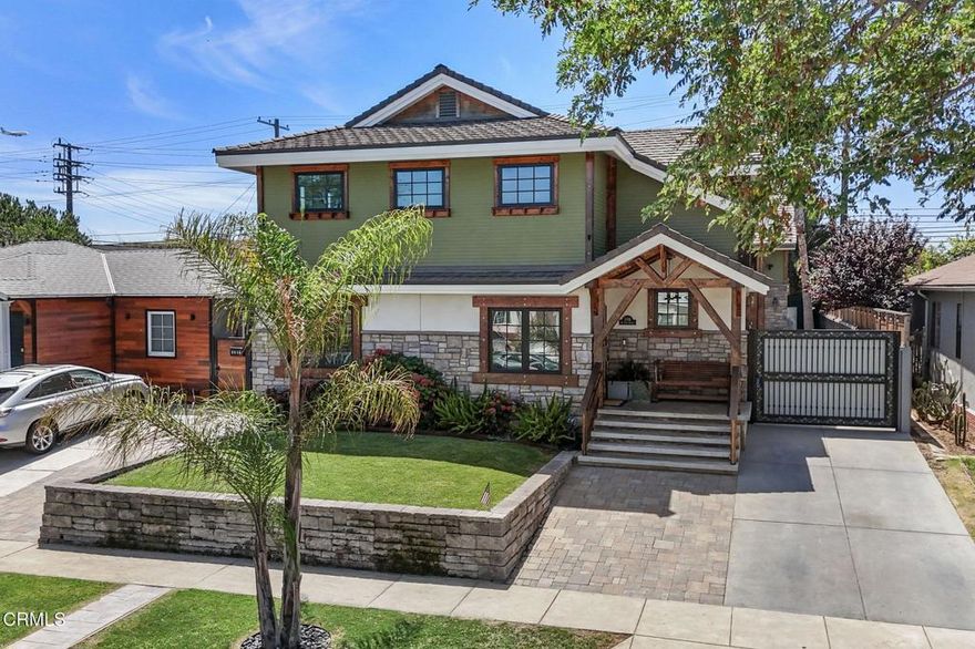 Nestled in the heart of Westchester's highly sought-after Osage enclave, this stunning custom-built Craftsman home is a masterclass in timeless architecture and modern sophistication. Crafted with extraordinary care and the finest materials, every element of this residence reflects refined taste and exceptional craftsmanship. Step inside to find a beautifully curated interior, where soaring ceilings, rich hardwood floors, solid wood farmhouse doors, elegant wainscoting, and intricate crown molding create a sense of effortless luxury. Designer lighting accents each space, while premium Andersen dual-pane windows--featured throughout the home--flood every room with natural light and ensure optimal energy efficiency and year-round comfort. At the heart of the home lies the gourmet chef's kitchen, appointed with a professional-grade 6-burner range, a farmhouse sink, expansive custom island with seating and storage, a walk-in pantry, and extensive cabinetry. This culinary haven seamlessly connects to the inviting family room, anchored by a striking linear electric fireplace with fire glass crystals and enhanced by Nest-integrated climate control. Entertain with grace in the formal dining room, or unwind in the expansive open-concept living area. The sumptuous primary suite is a true retreat, featuring exquisite custom tilework, a spa-like soaking tub, walk-in shower, and a generously sized walk-in closet. Additional bedrooms are thoughtfully designed with upscale finishes and ample storage, offering comfort and privacy for all. French doors lead to a beautifully constructed wraparound wooden deck--ideal for elegant entertaining or serene evenings under the stars. The landscaped and irrigated front yard enhances the home's undeniable curb appeal. Completing the property is a fully finished three-car detached garage topped by a versatile loft/flex space with its own en-suite bath. Whether envisioned as a guest suite, private office, gym, ADU, or game room, this bonus space adds flexibility and effectively serves as a fourth bedroom and bath. Infused with classic Craftsman character and elevated by sophisticated modern updates--including handcrafted stone detailing, smart home integrations, and high-performance dual-pane windows throughout--this exceptional residence presents a rare opportunity to own a true architectural gem in one of Los Angeles' most desirable neighborhoods.