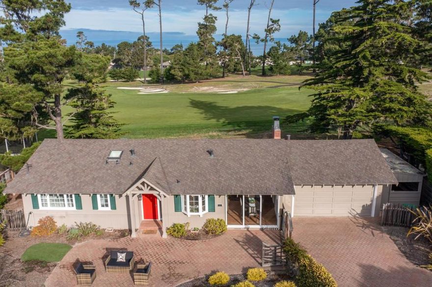 Charming Pebble Beach cottage in highly desired Country Club West. You will be impressed by the double fairway views of MPCC Shore #1 and Dunes #18 with strong peeks of ocean across to Santa Cruz Mountains. The front entrance includes a serene landscaped yard w/putting green and spacious paver patio perfect for relaxing or entertaining.  The floor plan features a kitchen with abundant counter and storage space open to the dining area which flows to an oversized living room with wall-to-wall windows. Watch golfers going by while sitting in front of your fireplace or on the fully enclosed back patio with raised flowerbeds.  Primary bedroom is ensuite while two guest bedrooms with large windows also enjoy expansive golf course views.   Deep 2-car garage includes a separate laundry room and connects to a workshop which has lots of extra storage.  Ideally situated 9,700 sqft lot offers a significant opportunity to expand if desired along with extra water credits. Here is your opportunity to live the Pebble Beach lifestyle within minutes of the MPCC clubhouse and ocean.