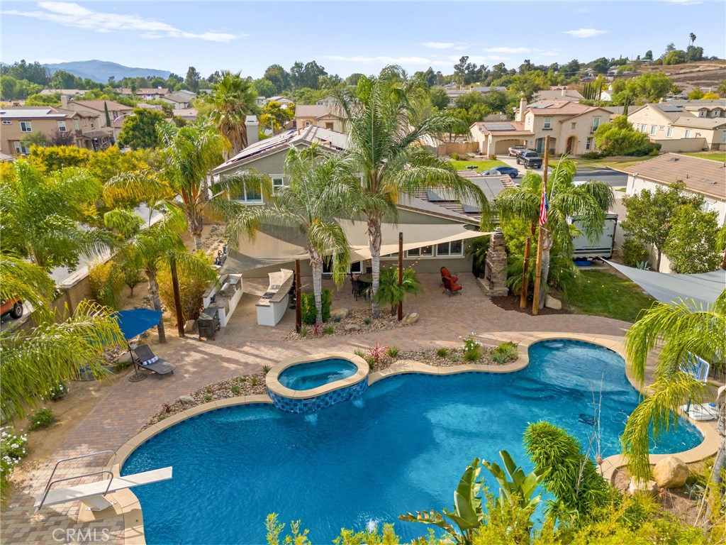 Welcome to this stunning 5-bedroom, 4-bath home, proudly offered by the original owners. Situated on an expansive corner lot of over half an acre, this property is perfect for both everyday living and entertaining. At the heart of the backyard is a spectacular 100,000-gallon Pebble Tec pool, complete with an outdoor kitchen and fireplace, creating the ultimate gathering space—perfect for hosting team parties or family celebrations.
Inside, you’ll find an upgraded kitchen featuring quartz countertops and modern finishes, along with two cozy indoor fireplaces for added warmth and charm. With RV parking, paid solar, and plenty of room to add an ADU, this property offers both convenience and potential.
A rare opportunity combining space, upgrades, and endless entertainment possibilities—this home is truly one of a kind!