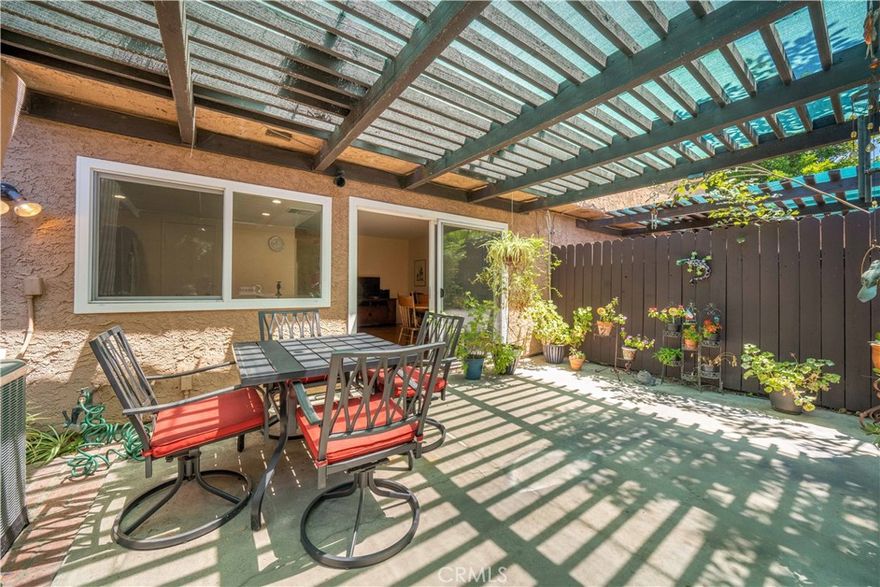 Major Price Reduction! LOTS OF UPDATES!! Home in great condition! Beautiful 2bed 2.5bath Winnetka townhome in gorgeous, gated Franciscan Park community SHOWS BETTER THAN THE PHOTOS!! Two story townhome with no one above or below!  Kitchen remodeled in 2022 features quartz counters, white shaker cabinets, tile backsplash and all kitchen appliances replaced to new that year. Half bath located downstairs. Both bedrooms upstairs have en-suite bathrooms and ample closet space!!  Primary suite bathroom was remodeled in 2022 with beautiful tiled shower. Primary suite closet has builtins for more efficient closet storage. Your own private 2 car garage with direct access to your large shaded patio. ELECTRICAL PANEL REPLACED 2022! NEW HVAC installed 2023! NEW WINDOWS installed 2021. WOOD FLOORING installed 2019. WATER HEATER replaced 2021. This super cute little neighborhood is like an oasis in the desert with park like grounds, sparkling community pool, lots of guest parking and it’s located right in the center of town! Quick drive to 101 and 118 freeways. Park across the street has tennis courts and children's playground. Easy access to Malibu Beaches, and nearby shopping in Woodland Hills / Ventura Blvd.