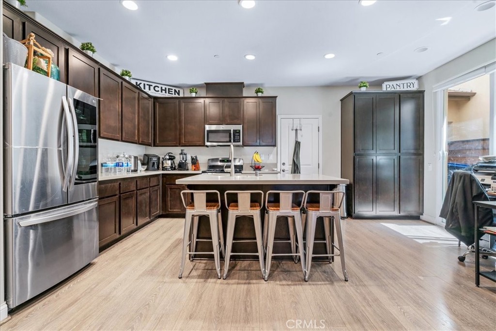 Discover this beautifully designed 2,170 square foot home in the gated Woodridge Community of South Atascadero. This 4-bedroom, 3-bathroom residence at 9361 Ranada Drive features an open floor plan with a spacious great room, modern kitchen with center island, and seamless flow to the dining and living areas. The main floor bedroom/office/den is open to the entry and privacy can be added with the addition of a door. It has an adjacent bathroom for added convenience. Upstairs, you'll find three well-appointed bedrooms including a generously sized primary suite with luxurious ensuite bath, walk-in closet, vaulted ceilings and a versatile loft above perfect for fitness, business, or relaxation. The two additional upstairs bedrooms share a thoughtfully designed bathroom with double vanities, while a dedicated laundry room with built-in storage cabinets and utility sink complete the upper level. Additional features include an attached 2-car garage, a covered seating area that is located off the front entrance with stunning oak-studded views and direct access to Las Lomas trails. This move-in ready home offers the rare combination of gated community living, natural surroundings, and modern amenities in one of South Atascadero's most sought-after neighborhoods. Call your agent today to schedule a showing. Information deemed reliable but not guaranteed.