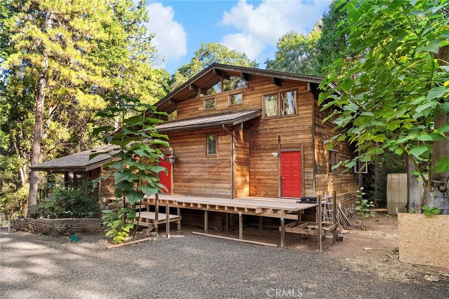 Peaceful private mountain home nestled among trees and wildlife sitting on roughly 14 acres! The home offers two primary suites, one on lower level and one on upper level, with additonal bonus room for 3rd bedroom upstairs. Bedrooms have new carpeting and spacious bathrooms with double sinks, jacuzzi tubs along with walk in showers. The main heart of the home offers, beamed ceilings, lots of windows for views and natural light, an open floor plan, connecting the living, dining, kitchen, and den areas. The den is an inviting space for intimate gatherings or quiet contemplation.  The laundry room, equipped with a sink, cabinets, and a convenient half bath, with exterior service door to front deck. The kitchen showcases a newer fridge, double ovens, garbage compactor, microwave, dishwasher, and an appliance garage, complemented by ample pantry space. A gas log fireplace adds warmth to the living room, while ceiling fans throughout ensure optimal airflow. Downstairs, a spacious unfinished basement invites endless possibilities for customization, allowing you to tailor the space to your specific needs and preferences. Step outside to enjoy three decks, each providing a tranquil retreat amidst the natural beauty, with the main front deck just finished and all new with custom lattice work railings. Over the last year the seller has installed full owned solar with two Enphase battery backs ups and a car charging hook up. New roof in 2024 as well prior to Solar, new high end split systems for heat and air, one in main room downstairs and two units in each bedroom. Seller has also completed new decking, added a covered carport, gravel in driveway, and created a wonderful fruit tree garden with an amazing array of choices. The home sits on roughly 14 acres, solid good well with new engagement box for smooth motor operation and there is also a year round spring in the center of property below the home. If you're looking for peace and tranquility, this may just be the one!!