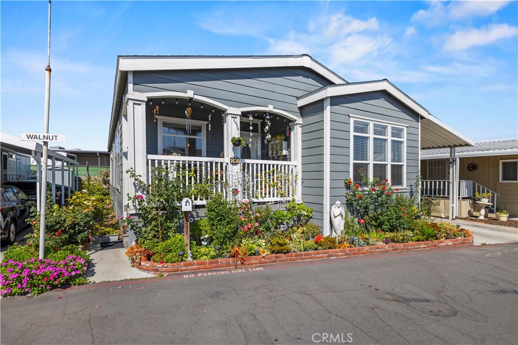 Welcome to 21 Walnut Via, a beautiful 3 bedroom, 2 bathroom manufactured home built in 2017 that combines modern finishes with functional design in the heart of Anaheim. From the moment you step inside, you’ll appreciate the open and inviting floor plan featuring a great room with 9’ flat ceilings, crown molding, and laminate wood flooring throughout the main living areas.
The gourmet kitchen is a true centerpiece of the home, designed with a huge center island perfect for casual dining, entertaining, or extra prep space. Abundant cabinetry, and built-in storage in the kitchen and laundry room provide ample space to stay organized. This thoughtfully designed kitchen also includes stainless steel appliances: a side-by-side French door refrigerator, stove, microwave, and dishwasher. Adjacent to the kitchen, you’ll find both an eat-in breakfast area and a formal dining room, creating flexible spaces for everyday meals or hosting larger gatherings.
The primary bedroom suite is generously sized, offering a peaceful retreat complete with a walk-in closet and a luxurious bathroom featuring a large walk-in shower. Two additional bedrooms are versatile for family, guests, or use as a home office.
Additional highlights include dual-pane energy-efficient windows, central air conditioning, and a covered porch, perfect for relaxing or entertaining outdoors. Parking is available for two or more vehicles, providing convenience and ease for households with multiple cars.
This home offers both style and comfort with an emphasis on functionality. Its prime location places you near shopping, dining, entertainment, and Anaheim’s popular attractions. Whether you are looking for your first home, downsizing, or simply seeking a move-in ready property, 21 Walnut Via delivers the space, features, and lifestyle you’ve been waiting for.