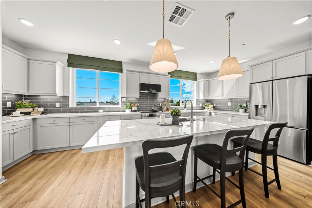 This home is the fastest selling plan at Palmera. The highlight is the huge kitchen with tons of countertop and cabinet space and the wide-open floorplan. Currently this is the only one left and it will not last long! The ground floor offers a large two car garage and a bonus room that can function as anything from a yoga studio to a game room and everything in between. The second floor offers a large kitchen with a huge island, dining area, large family room and powder room. The third floor has the primary bedroom and bathroom and two spacious secondary bedrooms and another full bathroom.
Palmera will have a full gym, two pools, study space, a clubhouse and a dog park as well as onsite shopping and dining! This vibrant townhome community is ideally located in the city of Camarillo and is just fifteen minutes to gorgeous coastline and beaches, the legendary Camarillo Outlets, and less than a moment’s drive to the Metro Link/Amtrack station. Palmera is just a stroll to Old Town which offers great restaurants, bars, boutique shops, salons, art, and entertainment, not to mention the farmers market every weekend.