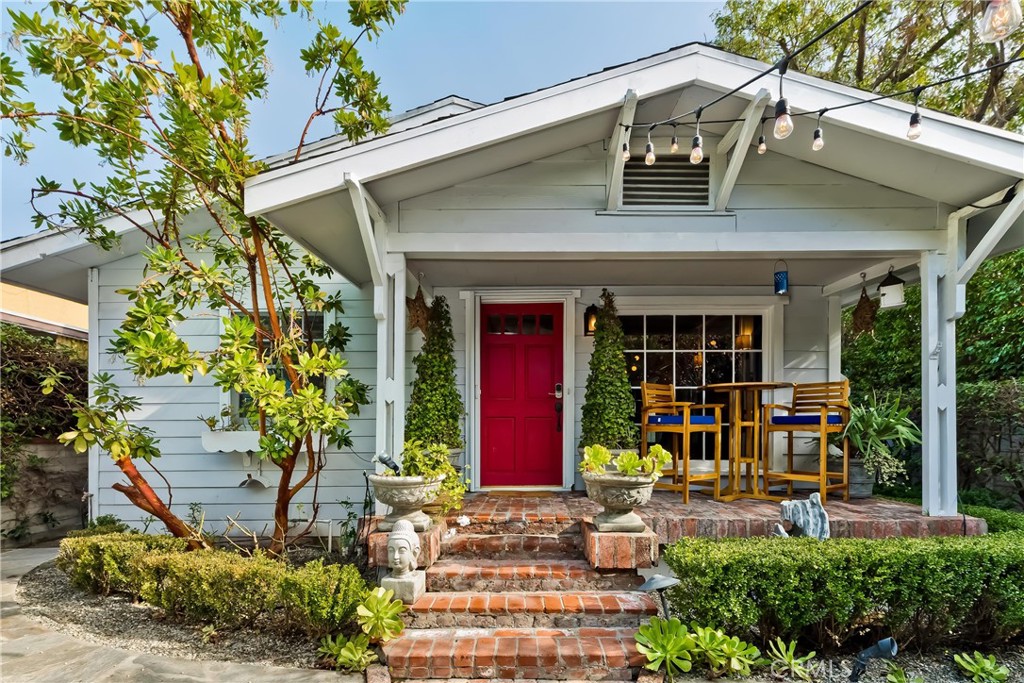 Offering a fully furnished rental in West Hollywood, this English cottage provides a convenient location just steps away from the Beverly Center, Pacific Design Center, and Cedar Sinai. The private home boasts a spacious garden complete with abundant outdoor seating, a dining area, and a BBQ. Inside the house, you're greeted by a delightful living space with wood beams, a comfortable sofa, and a cozy fireplace. Cottage windows offer views of the garden, creating a charming atmosphere. The dining area accommodates four people and includes a cocktail bar for your leisure.
The master bedroom features a king-sized bed, a flat-screen TV, and ample closet space. A generously sized bathroom offers two separate vanities, a bathtub, and a shower. An additional bedroom with a double bed provides plenty of closet space and its own flat-screen TV. The country-style kitchen is fully equipped with a dishwasher, refrigerator, stove, and all necessary cookware, dishes, and amenities. Stackable laundry is located in kitchen and large storage area. There is a split AC unit.
Parking options include both driveway and street parking. The property is exceptionally private, enclosed by gates. The location is conveniently situated just a short stroll from exceptional restaurants, shopping, and vibrant nightlife. Worth noting, the property encompasses two houses on a single lot. These properties are distinct from each other and are accessible from two different streets.