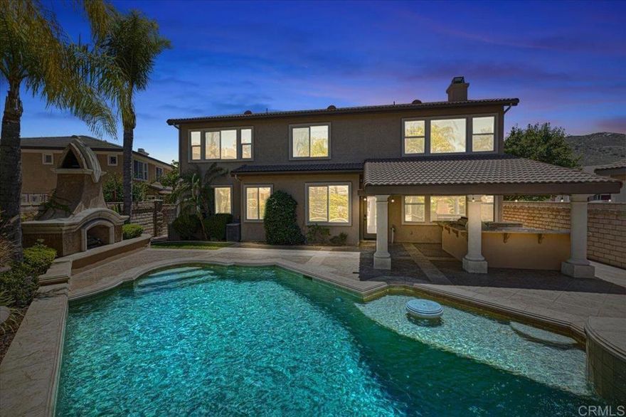 Tuscan elegance meets modern comfort in Copper Canyon. This stunning, newly refreshed Tuscan-style estate sits on a quiet cul-de-sac in West Murrieta’s coveted Copper Canyon neighborhood with NO HOA and LOW TAXES. With 4 bedrooms (possible 5th bedroom conversion downstairs), 2.5 baths, a spacious upstairs bonus room, a dedicated den, and nearly 3,450 sq ft of premium turnkey living space—including a 3-car garage—this home is thoughtfully designed for both everyday comfort and effortless entertaining.  Freshly updated Kitchen Counters and matching Appliances, with NEW high-quality Carpet, Paint and Backyard Block Wall heightened for maximum privacy! Enjoy resort-like outdoor living with mountain views from your private backyard oasis and primary bedroom balcony in the evenings. The backyard features a custom pool and spa with waterfalls and a PebbleSheen bottom, stamped concrete throughout, block wall fencing, a high-quality covered patio, a large outdoor fireplace, and a built-in BBQ with a large bar—plenty of space to entertain or relax in peace. The inviting entry showcases a sweeping walkway, custom gates, and a peaceful courtyard with a fountain. Imported custom front double doors open to a dramatic foyer with soaring ceilings and a wraparound staircase. Inside, you'll find brand-new upgraded luxury carpet, fresh interior paint, and a flexible den with built-ins—perfect for working from home or converting to a downstairs bedroom. The open-concept kitchen features all-new quartz countertops, a 5-burner stainless steel cooktop, matching microwave, and a farmhouse-style sink, flowing into the family room with a gas fireplace and direct backyard access. Upstairs includes four bedrooms, two bathrooms, and a large bonus room. The spacious primary suite offers dual walk-in closets, dual vanities, and a deep soaking tub. Located within walking distance to top-rated Cole Canyon Elementary, close to local parks, just a short drive to hiking trails up in the Santa Rosa Plateau, and with quick freeway access and shopping—this home offers luxury, lifestyle, and convenience. Schedule your private showing today!