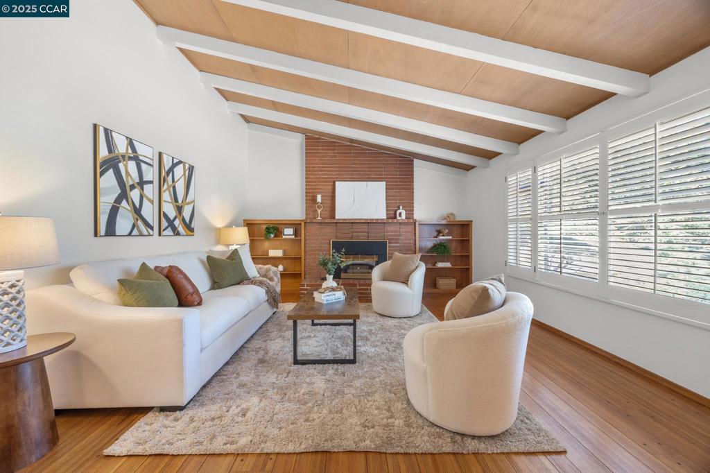 Nestled in the heart of the Walnut Knolls neighborhood, this 3-bed, 2-bath home offers an unbeatable location - right across the street from the community pool, park, and close to vibrant downtown Walnut Creek. Located within the Walnut Creek and Acalanes school districts, this home provides easy access to Murwood Elementary and Las Lomas High. Just over the bridge is the Iron Horse Trail, perfect for walking, running, or biking. Freshly painted throughout, the home features vaulted ceilings with exposed beams, a cozy brick fireplace, and custom built-ins. The formal dining room flows into the living area - great for daily living or entertaining. A spacious family room with a second fireplace opens to the backyard for seamless indoor-outdoor living. Once owned by a beloved local art teacher, the home is filled with artistic charm, including handcrafted stained glass and custom cabinetry. All three bedrooms are upstairs, filled with natural light and treetop views. Situated on a large lot with ample outdoor space, this home offers incredible potential for its next owner to expand, renovate, or simply enjoy as-is. Don’t miss this rare opportunity to own a truly special home in a beloved Walnut Creek neighborhood!