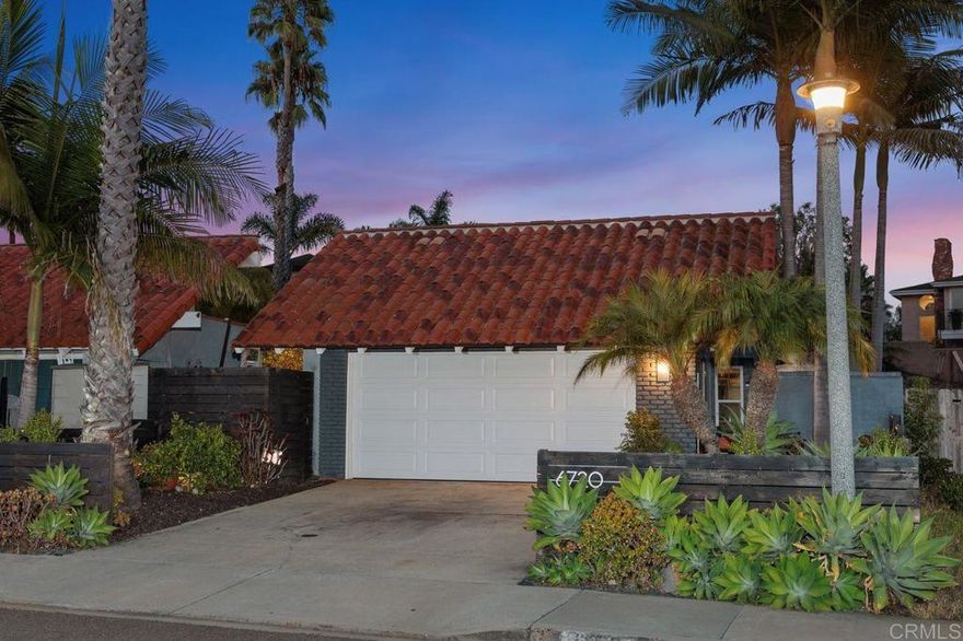 Stylish, remodeled single-level twin home located in the highly sought-after La Costa Meadows neighborhood (No HOA or fees). From the moment you enter, you’ll be impressed by the spacious great-room design, custom front door, beautiful hardwood floors, and abundant natural light. Three sets of French doors run the length of the back of the home and open to a large patio and beautifully landscaped yard—perfect for entertaining and embracing the indoor-outdoor SoCal lifestyle. Enveloped by mature tropical landscaping, the home is beautifully framed from every angle—from the welcoming front yard to the serene backyard retreat—creating a true oasis-like setting that enhances the home’s natural charm. The recently remodeled kitchen showcases shaker-style white cabinetry, a versatile movable island, quartz countertops, and a stainless-steel tile backsplash—combining modern design with everyday functionality. The spacious primary bedroom features its own set of French doors opening to a beautifully landscaped private patio, creating a tranquil retreat. Inside, you’ll find two closets, including one walk-in, and a remodeled en-suite bathroom with a dual vanity and custom walk-in glass-enclosed shower. A beautifully finished detached studio, just steps from the main home, provides the ultimate flexible space—perfect as a private office, art studio, or home gym. Upgrades include newer windows, roof, rerouted plumbing, AC/furnace, and beautifully remodeled 2nd bathroom. The finished garage further expands the home’s livable footprint, offering endless possibilities as a family game room, creative studio, or private retreat. Tucked away in a quiet, private, and serene location within the San Marcos School District, just blocks from the highly esteemed La Costa Meadows Elementary School.