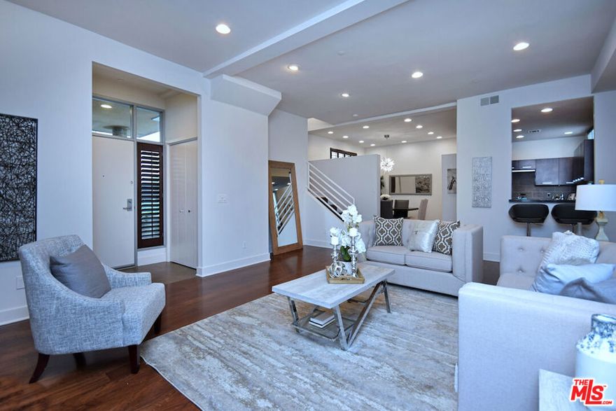 Nestled in one of Studio City's most coveted neighborhoods South of The Boulevard, this rare 3+2.5  town home is just under 2,000sf and features gleaming wood floors in the living areas, oversized bedrooms,  a large front sitting patio, a huge private rooftop deck and a loft  that is perfect for a home office. Totally redone with designer finishes, this property feels more like a home and boasts an enormous Master Suite with vaulted ceilings and a spa-like bath with separate tub, frameless glass shower and dual sinks. The Kitchen offers updated stainless steel appliances. Two side by side parking spaces in a secured garage, laundry inside the unit and extra storage space are just a few of the amazing upgrades that make this rental unit so special. Carpenter School District and right around the corner from some of Studio City's best restaurants and retail stores.