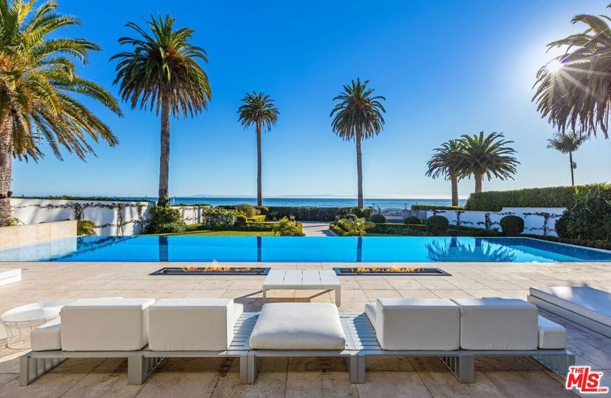 On the prestigious Butterfly Beach, this newly renovated half-acre oceanfront estate unveils panoramic Channel Island & ocean views that stretch out into the horizon across its 101ft of south-facing frontage. Behind the gates & lush hedges, this private entertainment paradise boasts a large motor court, rooftop entertainment deck, zero-edge pool, expansive terraces & patio w/ pizza oven fireplace. Near Four Seasons Biltmore, Coast Village & Santa Barbaras premier destinations. Smart home reflecting cutting-edge trend features a glowing backlit onyx fireplace, frameless pocket glass doors throughout. 3 vaulted en suite beds include primary suite w/ lounge, office & spa-like bath. Only 15 houses on all of Channel Dr. Experience this rare opportunity to join the exclusive coastal communities.