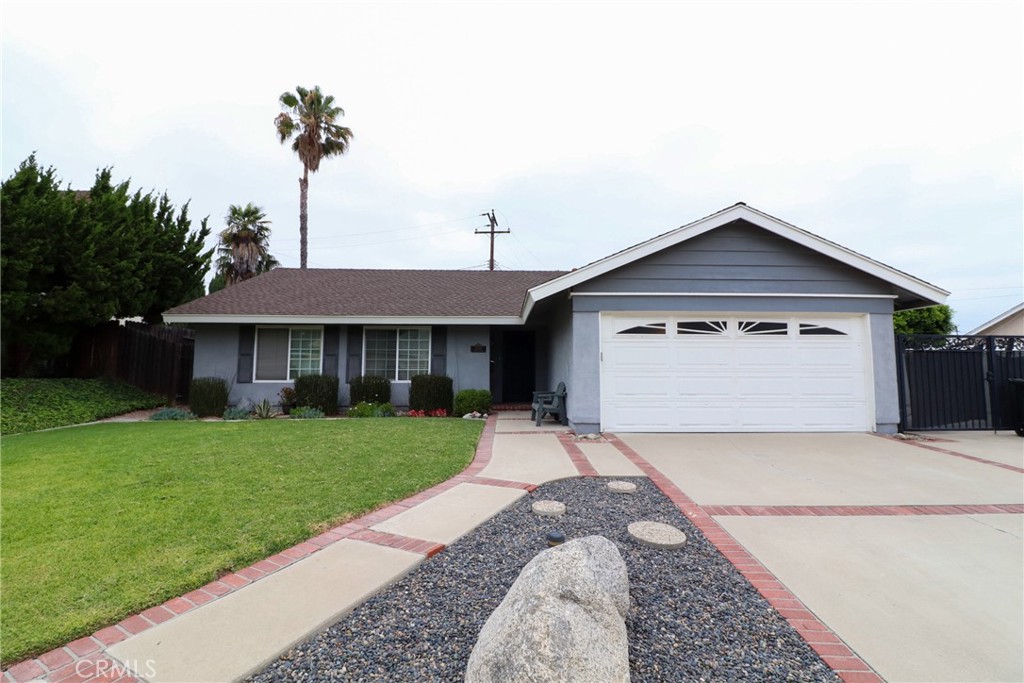 BUILT IN 1968, THIS SINGLE-STORY RANCH HOME ORIGINALLY A 4 BEDROOM 2 BATH, THE 4TH BEDROOM WAS CONVERTED TO CREATE A FAMILY ROOM. WELL MAINTAINED OVER THE YEARS. REMODELED KITCHEN WITH ISLAND AND EATING AREA. GRANITE COUNTERS, MICROWAVE OVER THE RANGE. LOTS OF WINDOWS TO ENJOY THE SIDE YARD. LIVING ROOM HAS A WOOD-BURNING BRICK FIREPLACE OPEN TO A BONUS ROOM (NOT INCLUDED IN SQUARE FOOTAGE). 3 BEDROOMS WITH A FULL BATH. THE PRIMARY BEDROOM FEATURES AN EN SUITE BATH, AND DUAL CLOSETS.. CENTRAL HEATING AND AIR CONDITIONING. DIRECT ACCESS FROM THE ATTACHED 2-CAR GARAGE WITH LAUNDRY AREA AND BUILT-INS. SPACIOUS BACKYARD AND A SIDE YARD THAT HAS BEEN USED FOR RV ACCESS. ALMOST AN 8000 SQ.FT LOT. TOP RATED SCHOOLS. CLOSE TO SHOPPING AND FREEWAYS.