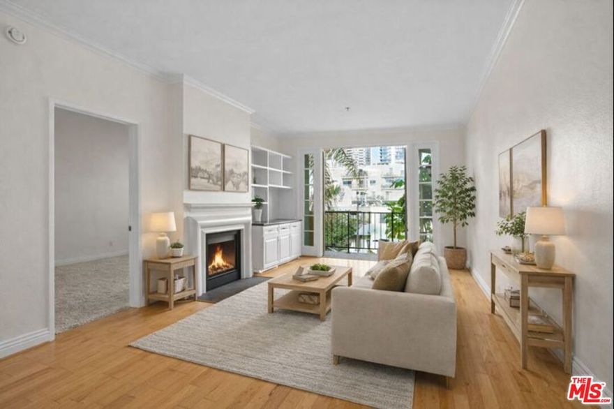 Experience elevated Westside living in this front-facing, single-level condominium ideally located Brentwood-adjacent and minutes from Santa Monica. Nestled in a boutique, well-maintained building, this light-filled residence offers the perfect blend of privacy, comfort, and walkable city living, all with quick access to the 405, 101, and 10 freeways. A secure, landscaped courtyard entry welcomes you into a peaceful and private setting, with controlled building and elevator access providing added security. The elevator opens just steps from your front door, and the home includes two assigned tandem parking spaces in a secure garage, conveniently located near the elevator. Inside, the spacious living room features hardwood floors, fresh paint, and a gas fireplace, complemented by custom built-ins and a dedicated workspace, ideal for modern remote living. French doors open to a private balcony, perfect for morning coffee or evening unwinding. The updated kitchen showcases calacatta quartz countertops, stainless-steel appliances, ample cabinetry, and a breakfast bar. Both generously sized en-suite bedrooms offer brand-new carpet, excellent closet space, and dual-vanity bathrooms, creating a comfortable and functional layout for roommates, guests, or a home office setup. Additional features include central air and heat with Nest thermostat, in-unit washer and dryer, crown molding throughout, intercom entry system, and a large private storage room, a rare and valuable bonus for Westside condo living. Enjoy a highly walkable location close to top restaurants, cafes, bakeries, boutiques, and neighborhood favorites, with Sawtelle, UCLA, Santa Monica, and the beach just minutes away. This move-in ready, airy, and serene home offers an exceptional opportunity to enjoy the best of Los Angeles Westside living.