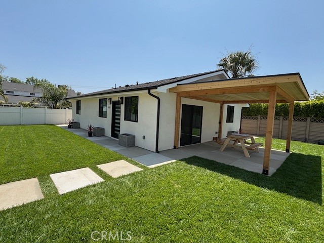Welcome to this brand new single-story detached ADU, offering a perfect blend of comfort, style, and privacy. Situated on a fully fenced 6,300 square foot lot near Stoney Point Park, this beautifully designed home features three spacious bedrooms and three full bathrooms, including two primary suites. One of the primary bedrooms includes a walk-in closet with custom built-in organizers, and all bathrooms feature oversized showers with high-end finishes. The open-concept living space is enhanced by recessed lighting throughout and includes a modern kitchen equipped with a stainless steel sink, side-by-side refrigerator, stove, oven, microwave, and warming drawer. Generous cabinet space ensures you’ll have plenty of storage for all your cooking essentials. A barn-style door adds charm to the hallway linen closet, while in-unit washer and dryer hookups provide everyday convenience. This home is built for comfort and efficiency with central air and heat, a tankless hot water system, and solar panels. Gas and electric are separately metered, and water is sub-metered. Step outside into a large private yard complete with a covered side patio and picnic bench just off the living room—perfect for relaxing or entertaining. A pergola with a wood-burning fire pit adds a cozy touch for evening gatherings. Gated parking with electric gate access offers added security and convenience. Located just minutes from the 118 Freeway, this home offers easy access to shopping, dining, and outdoor recreation, including hiking trails at nearby Stoney Point Park. This is a rare opportunity to enjoy a brand new, move-in ready home in a highly desirable area.