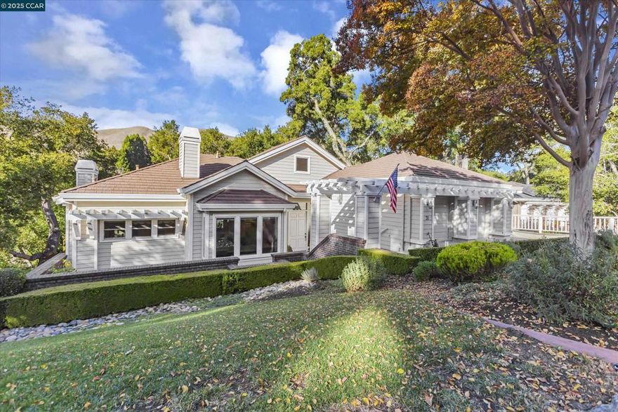 Located in the desirable gated Sanders Ranch Community, this stunning 4,331 sq.ft. home sits on a private, tree-studded & peaceful .93-acre lot. 31 Merrill Circle South is a contemporary gem that’s perfect for modern living. The home features an open floor plan with high ceilings, providing a spacious yet inviting atmosphere. Picture yourself enjoying your morning coffee on the deck, or hosting evening appetizers while little ones play on the large, level lawn below. On the bright & open main level, you’ll enjoy the gourmet chef's kitchen and the adjoining spacious family room with surround sound speakers & fireplace. The formal living room complete with another fireplace flows into the dining room with beautiful views of the rolling hills. The main level also features a half-bath & an expansive primary suite with a third fireplace, a full bath with jetted tub, private deck & large walk-in closet. The lower level offers flexible spaces, including three bedrooms, two full bathrooms (one en suite), a laundry room & a second family/media room. Recent upgrades include a new generator, new HVAC system & a new water heater. This wonderful home is also conveniently located near acres of open space & hiking trails, the year-round Moraga Farmers' Market & Moraga's award-winning schools.