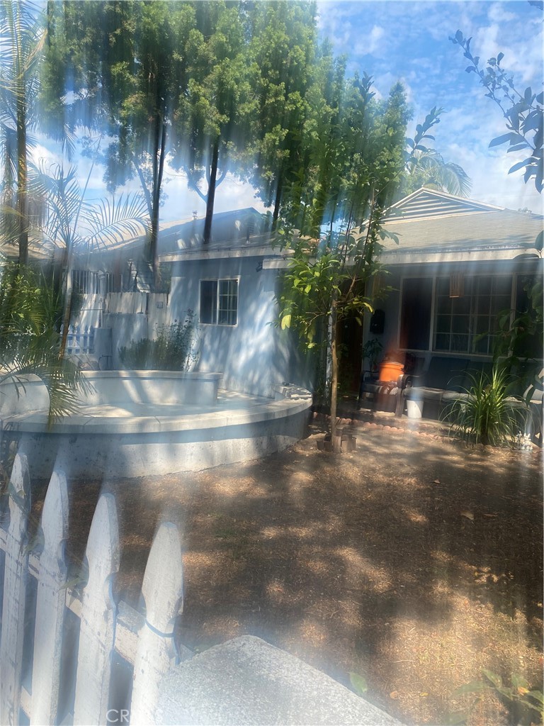 nice quiet neighborhood stores parks banks and schools all nearby. next to 91 freeway. house has 3 bedroom and 2 bathrooms, bonus studio attached to garage with full bathroom.