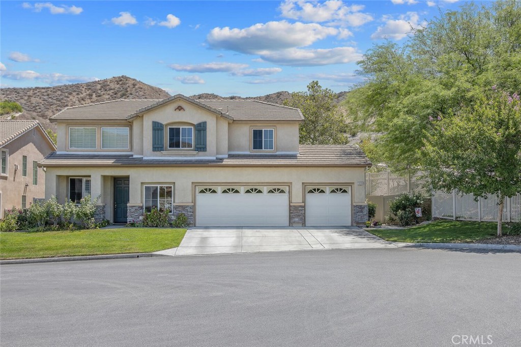 Tucked away on a quiet cul-de-sac in Canyon Country, this spacious 4-bedroom, 2.5-bath home plus loft has everything you’re looking for—and more! With over 2400 sq ft of living space, there’s plenty of room to spread out, relax, and enjoy. Step inside to high ceilings, durable and stylish hardwood flooring and plantation shutters throughout the downstairs. Enjoy an open floor plan that connects the formal living and dining areas to the updated, spacious eat-in kitchen—complete with newer appliances. The main level also includes a versatile den (potential 4th bedroom). Upstairs, the loft makes a perfect home office, game room, or cozy hangout space, along with 2 spacious additional bedrooms. The primary suite is bright and comfortable with its own private bath. Outside and you’ll find one of the best features: a premium, private lot with only one neighbor on one side and no rear neighbors! Enjoy your very own beautiful mountain views - it's the perfect spot to enjoy morning coffee or unwind after a long day. This home is move-in ready and close to schools, parks, shopping, and more. Come take a look—you’ll feel right at home!