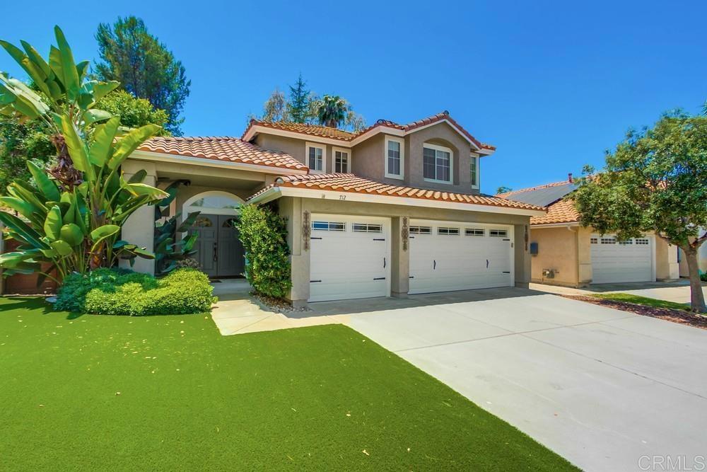 Nestled in the vibrant heart of Rancho Del Oro, 712 Palette Ct, is a warm and inviting home brimming with charm and an unbeatable location. Tucked away on a peaceful cul-de-sac, this well-loved residence offers a relaxed coastal lifestyle and endless possibilities to make it your own. Step through the door into a bright living room with soaring vaulted ceilings and newer laminate wood flooring that radiates cozy comfort. The kitchen, the heart of the home, shines with granite countertops, stainless steel appliances, a convenient breakfast bar, recessed lighting and pantry, perfect for whipping up meals and memories. It flows effortlessly into a welcoming family room, complete with a refaced fireplace, and a formal dining area ready for lively gatherings. Home is equipped with newer HVAC system w Nest controls. The private backyard is a standout feature, with mature trees, raised planter beds, and easy-care synthetic grass creating a serene retreat. A custom slate concrete patio shaded by a pergola sets the stage for outdoor relaxation, while a dog run keeps furry friends happy. With a spacious lot and a three-car garage packed with storage racks and cupboards, there’s room for everything you need. Downstairs has a versatile full bedroom and bath with updated flooring and a vanity offer flexibility for guests or family. A separate laundry room with a handy laundry chute adds everyday convenience. Upstairs, the master suite impresses with vaulted ceilings and a remodeled en-suite bath featuring double sinks, a soaking tub, and a walk-in shower—a perfect spot to unwind,. Positioned on a wide street with a generous driveway, this home blends privacy with easy access. Good local schools, bustling shopping, and the 76 freeway are just a short drive away, putting the best of Oceanside at your fingertips.