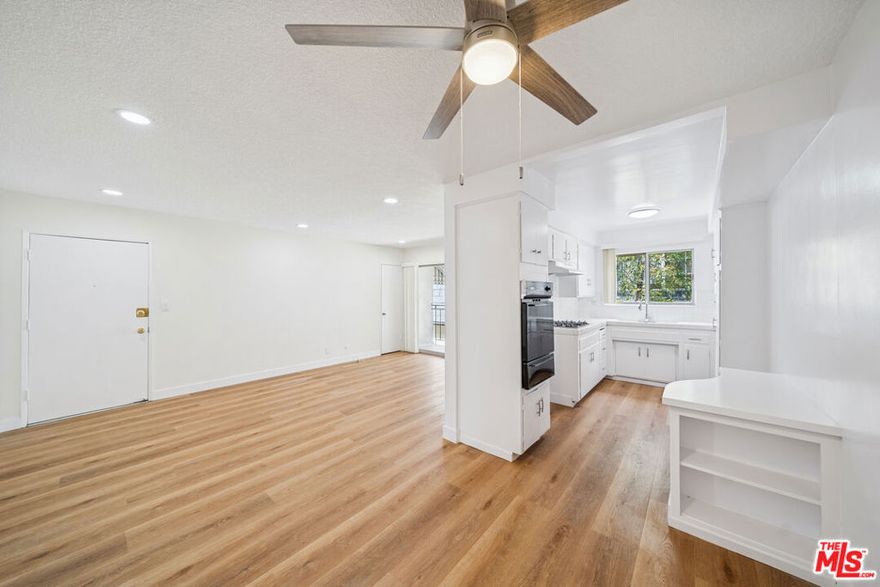 Situated in a prime West Hollywood location, this approximately upper-level 1-bedroom, 1-bath residence features an open layout that connects the living area and kitchen, creating a bright and functional living environment enhanced by abundant natural light. The kitchen includes ample cabinetry and a refrigerator, while the bathroom offers a separate tub and shower. Additional features include recessed lighting and ceiling fans for year-round comfort. A private balcony extends the living space outdoors, and gated parking is included for convenience. The surrounding neighborhood provides close proximity to shopping, dining, and entertainment destinations. Tenant pays gas, electricity, and trash; owner pays water. Pets permitted. All features, measurements, and availability are approximate; tenant to independently verify all information.