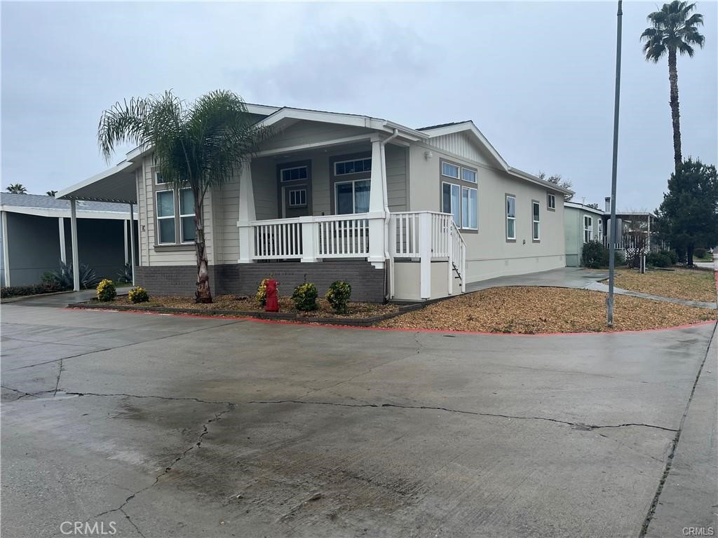 SEARCH NO MORE! This is a BEAUTIFUL 3 Bedroom, 2 Bathroom home in a family-friendly gated community. Walking into the home, you'll come into an open floorplan that features laminate flooring throughout the home. This home is one of the most beautiful homes in the community, sitting comfortably at just under 1500 sf. Outside you will find a seating area, partially covered, carport allowing 3 vehicles! Access to Banks and shopping centers, and Restaurants. DO NOT MISS OUT ON THIS WONDERFUL OPPORTUNITY! TAKE A LOOK TODAY!