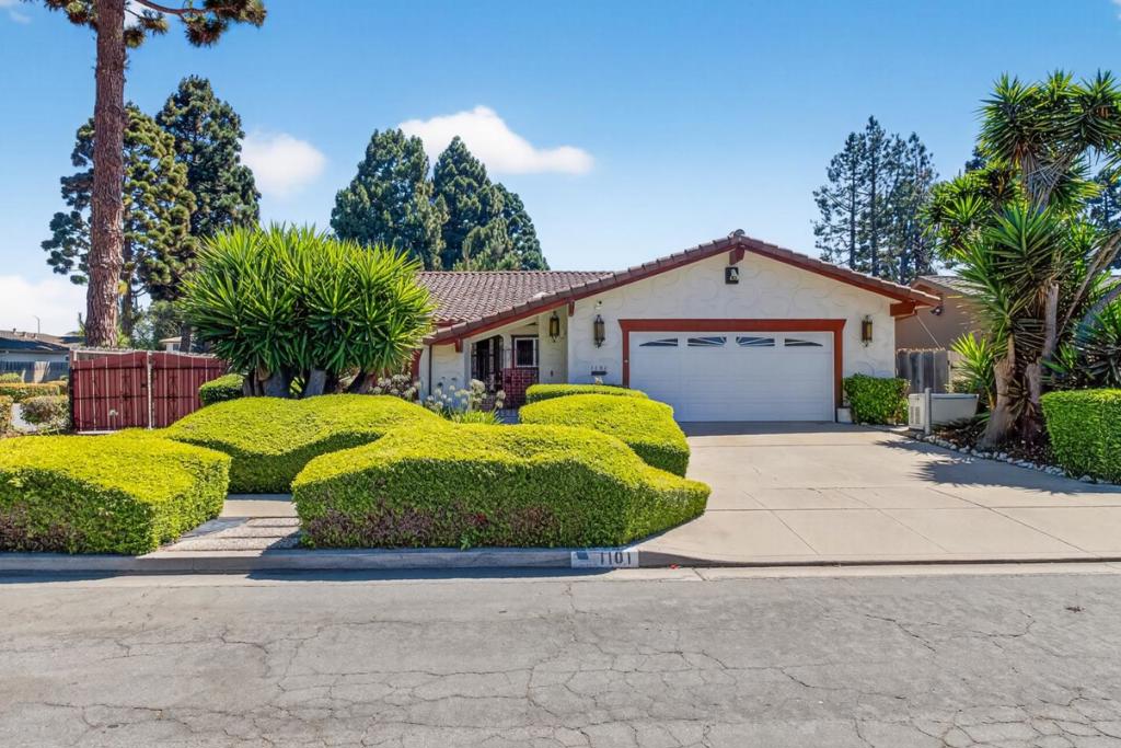 Nestled on a corner lot on a quiet cul-de-sac, this spacious 3-bed, 2-bath home is full of charm, comfort, and functionality. From the moment you enter the private courtyard, the stucco exterior, terra cotta roof, wrought-iron gate, and hand-carved wood front door create an inviting first impression. Inside, a formal foyer opens to generous living spaces. The open floor-plan kitchen features stainless steel appliances, a peninsula bar, and plenty of prep/storage space. Kitchen flows seamlessly into the living room which is centered around a cozy gas fireplace and built-ins. You'll enjoy the formal dining area w/ modern chandelier, while a separate family room looks out onto the courtyard. The freshly carpeted bedrooms are well proportioned, while the primary suite offers a walk-in closet, dual vanity, soaking tub with separate shower, as well as access to backyard via sliding door. The laundry room offers a bonus nook, ideal for home office w/ views of the front courtyard. Step outside to a sun-soaked 6,500 SF lot with several mature fruit trees. Air conditioning, 2-car garage w/ additional storage, and room for boat or RV on gated side yard, complete the package. All of this is set in a desirable South Salinas location, close to schools, parks, and everyday conveniences.