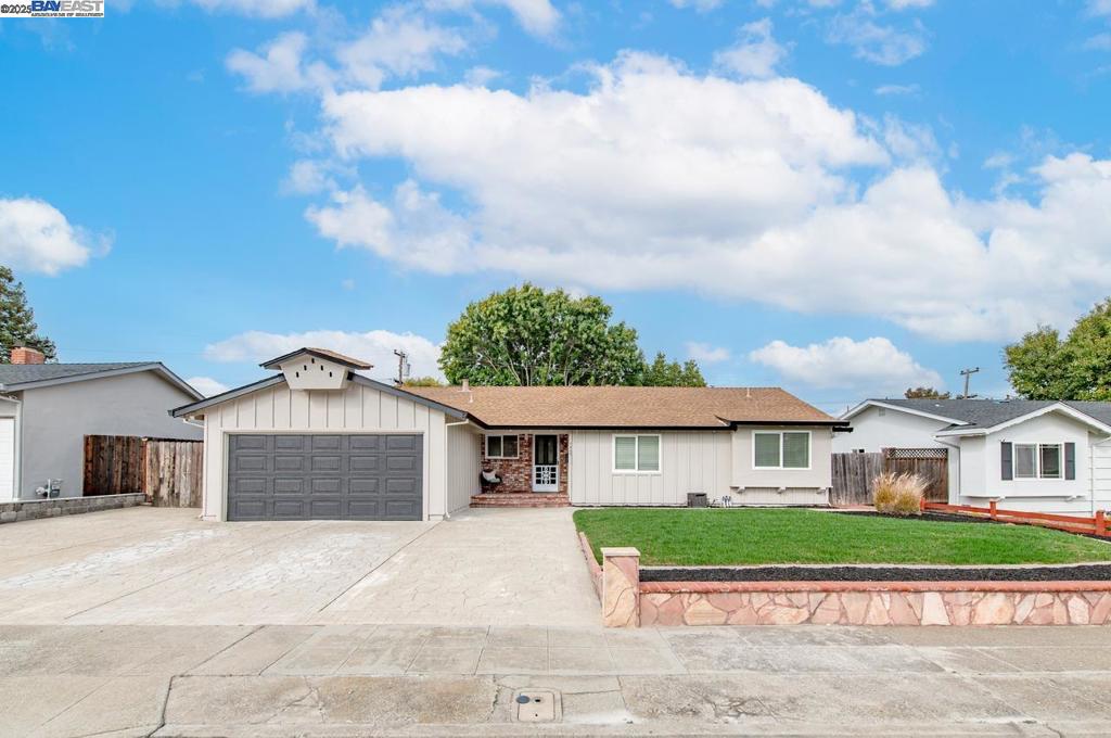 Charming single-level home in a highly desirable Dublin location! Large side yard access with large gate for boat/RV space! This 3-bedroom, 2-bath residence offers 1,424 sq. ft. of comfortable living space with a bright, open feel and neutral flooring throughout. The kitchen features solid oak cabinets, stone countertops, and a stylish tile-accented backsplash, plus room for more formal dining. The inviting main  room area includes a classic white brick fireplace and opens to the spacious backyard—perfect for relaxing or entertaining. The primary suite offers a mirrored closet and a private bathroom with a shower stall. Enjoy the extra-large backyard with a wooden deck patio, in-ground planter beds, mature trees, and convenient side yard access. Ideally located near top-rated schools, shopping, dining, and easy freeway access to both I-580 and I-680 for a smooth commute in any direction. This home blends comfort, charm, and convenience in the heart of Dublin!